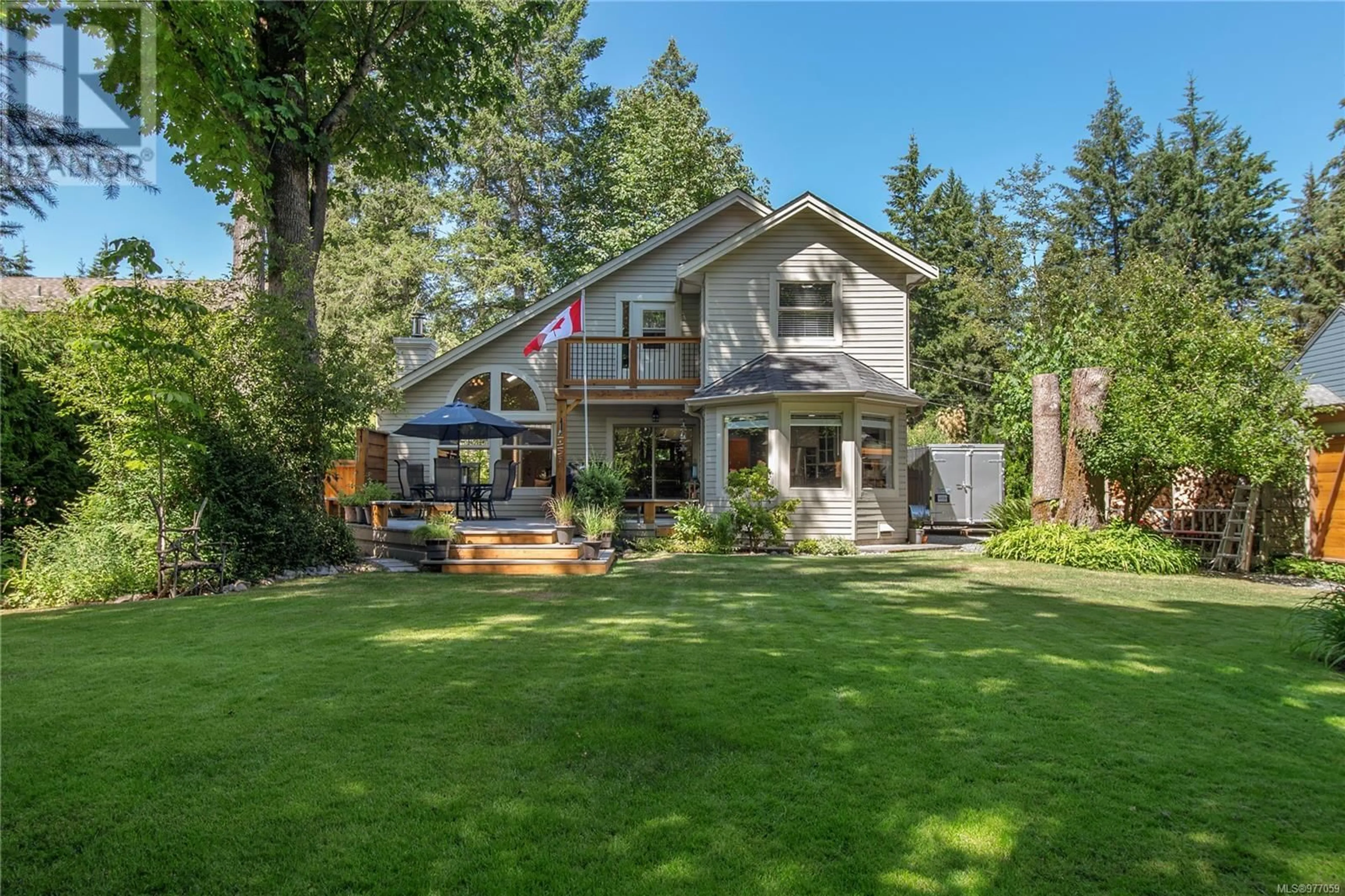 Frontside or backside of a home, the fenced backyard for 2001 Manston Rd, Black Creek British Columbia V9J1A6