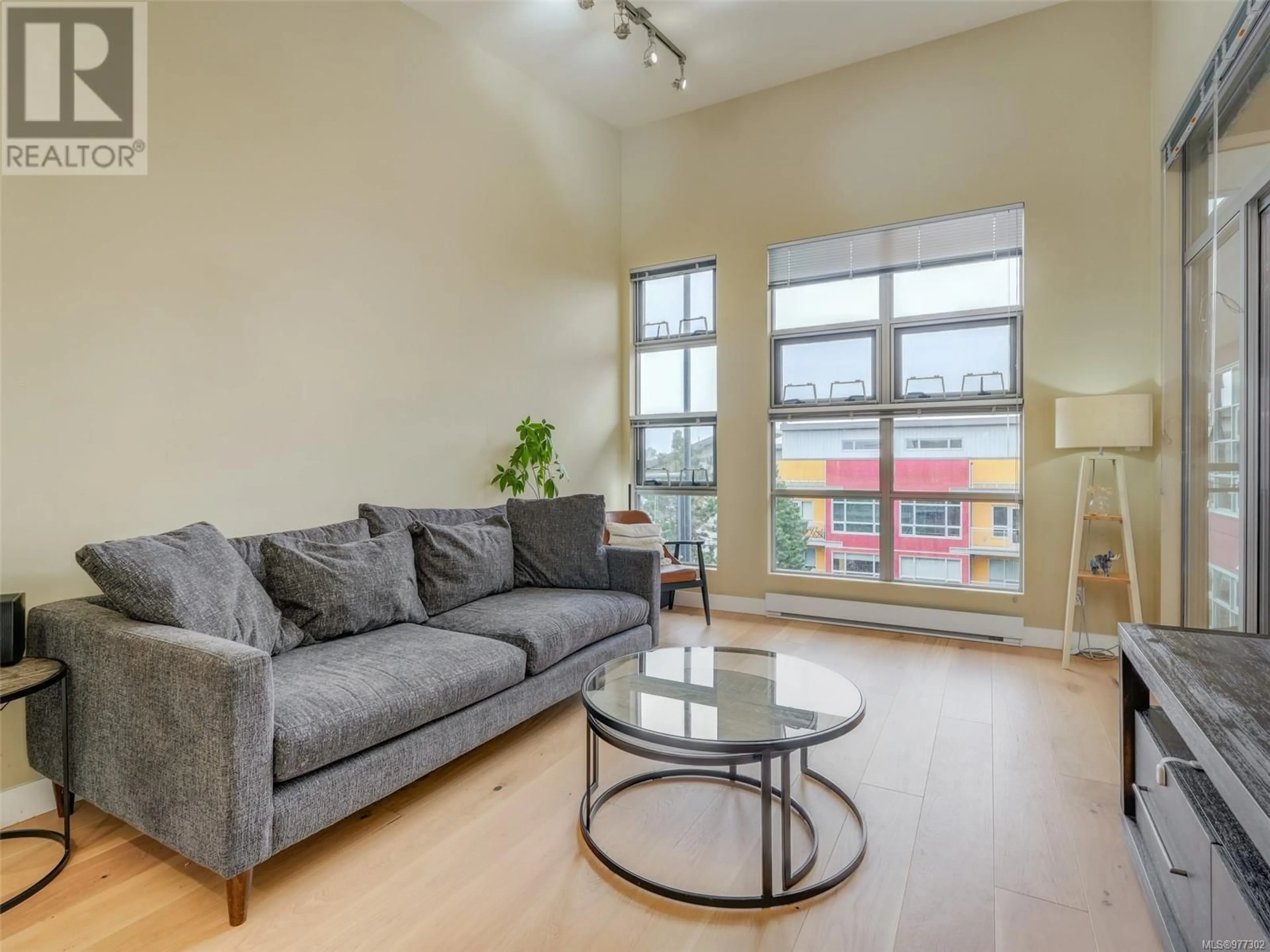 Living room, wood floors for 408 797 Tyee Rd, Victoria British Columbia V9A7R4