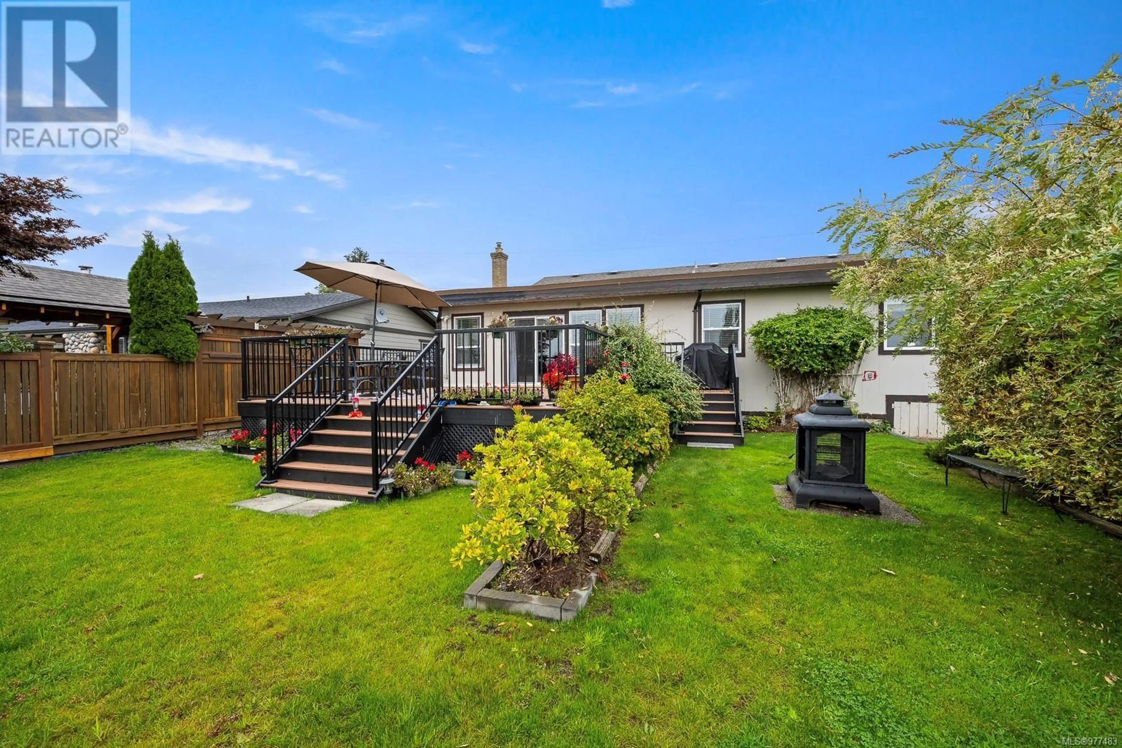 Frontside or backside of a home, the fenced backyard for 1199 Williams Rd, Courtenay British Columbia V9L5V8