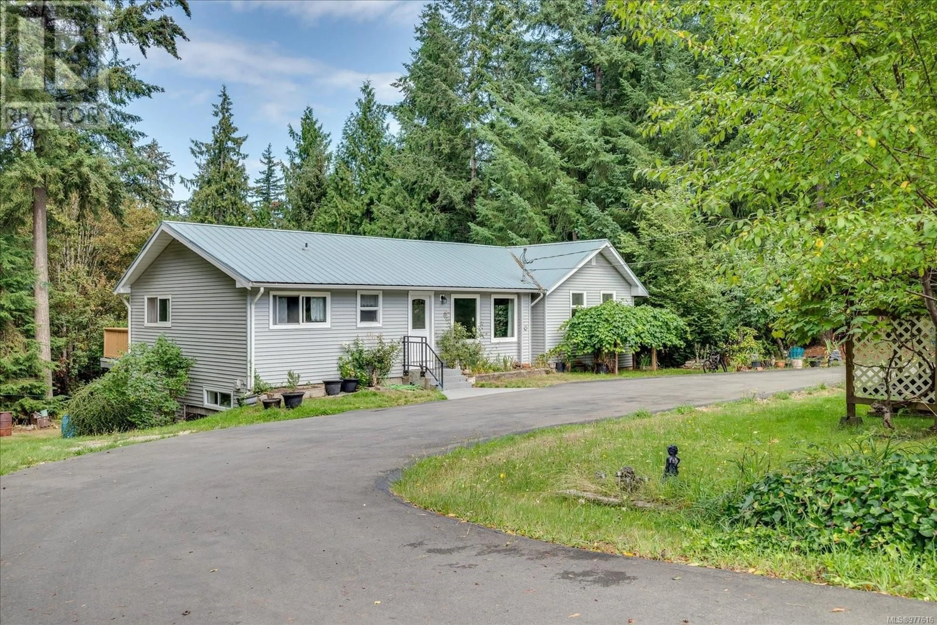 Frontside or backside of a home, cottage for 3115 Rinvold Rd, Hilliers British Columbia V9K1X3