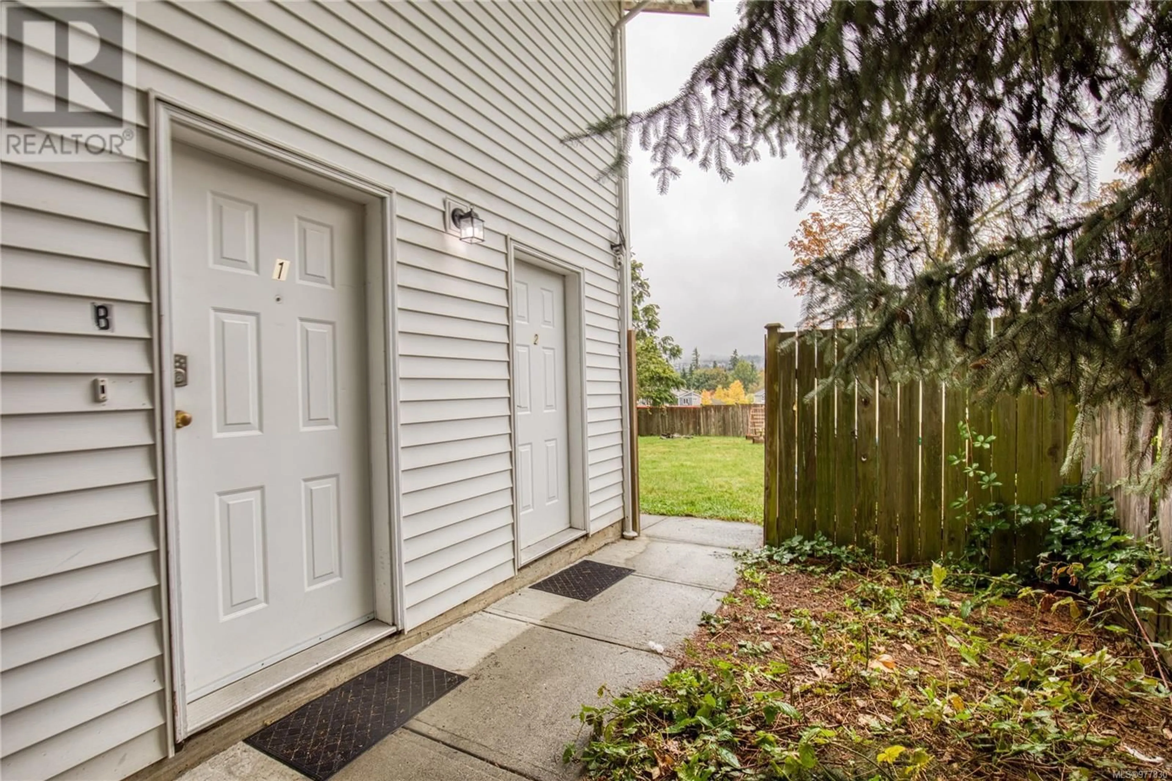 Patio, the fenced backyard for B 1639 Bowen Rd, Nanaimo British Columbia V9S1G7