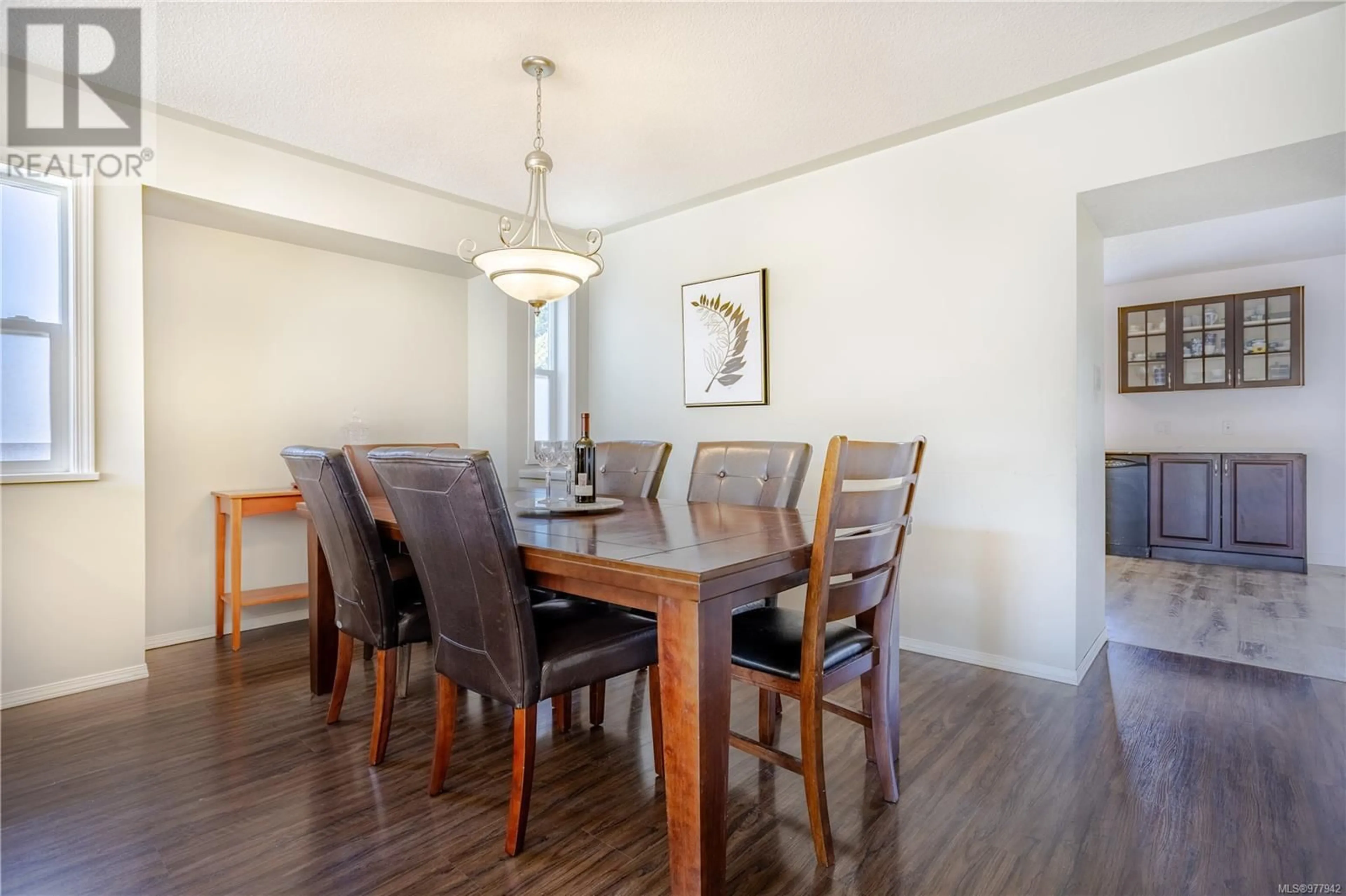 Dining room, wood/laminate floor for 6282 McRobb Ave, Nanaimo British Columbia V9V1M4