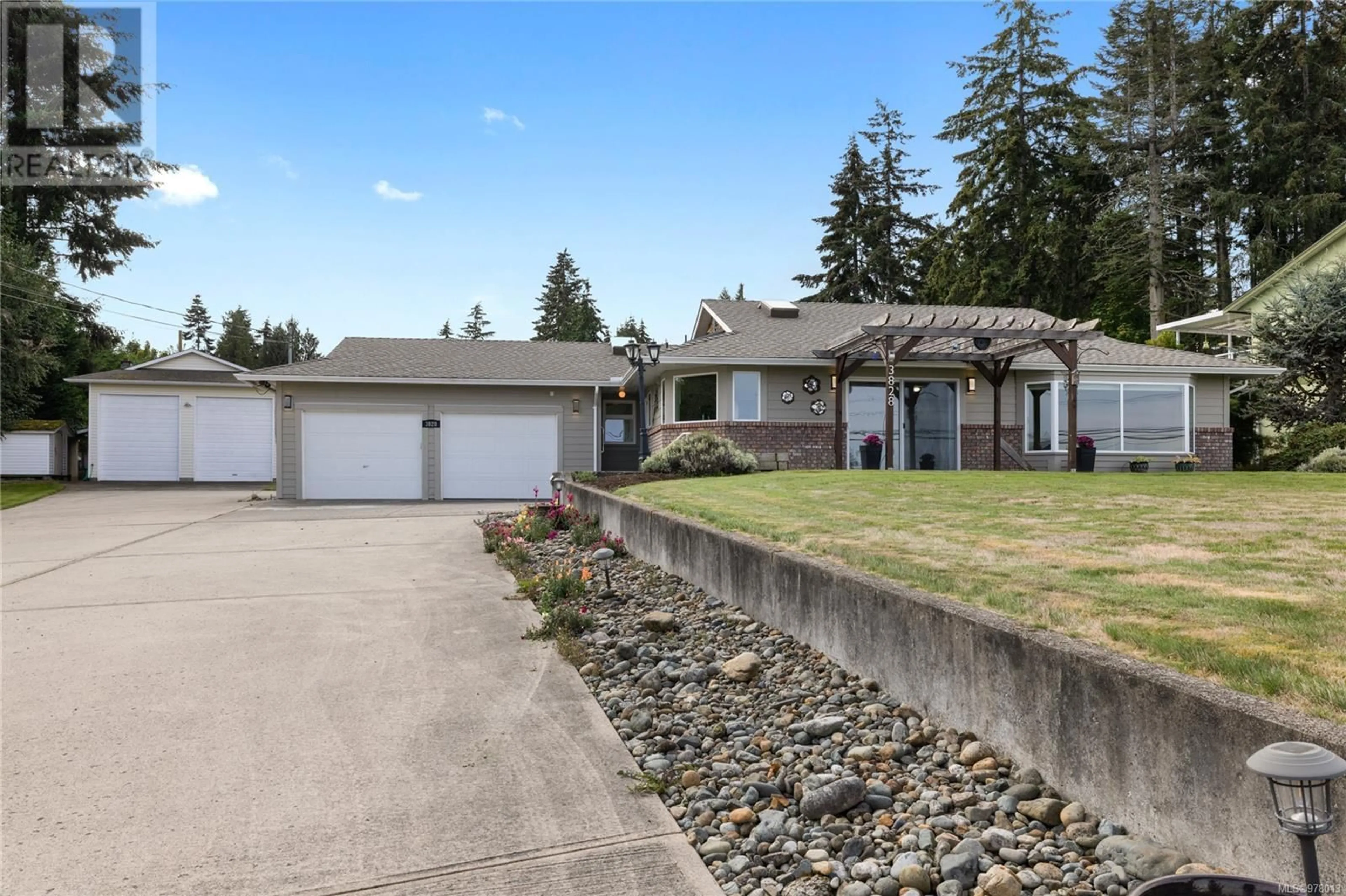 Frontside or backside of a home, the fenced backyard for 3828 Island Hwy W, Qualicum Beach British Columbia V9K2G9