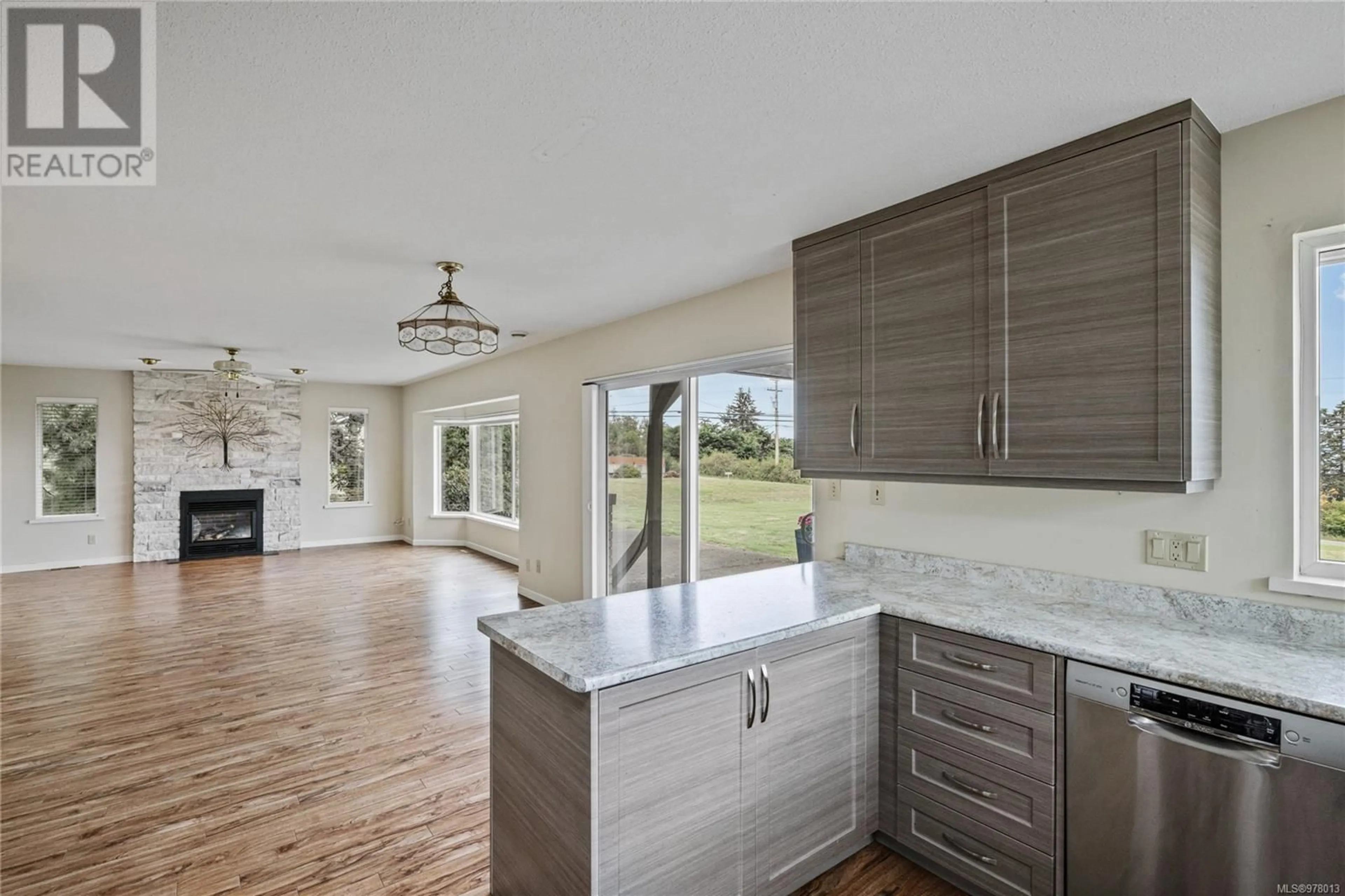 Open concept kitchen for 3828 Island Hwy W, Qualicum Beach British Columbia V9K2G9