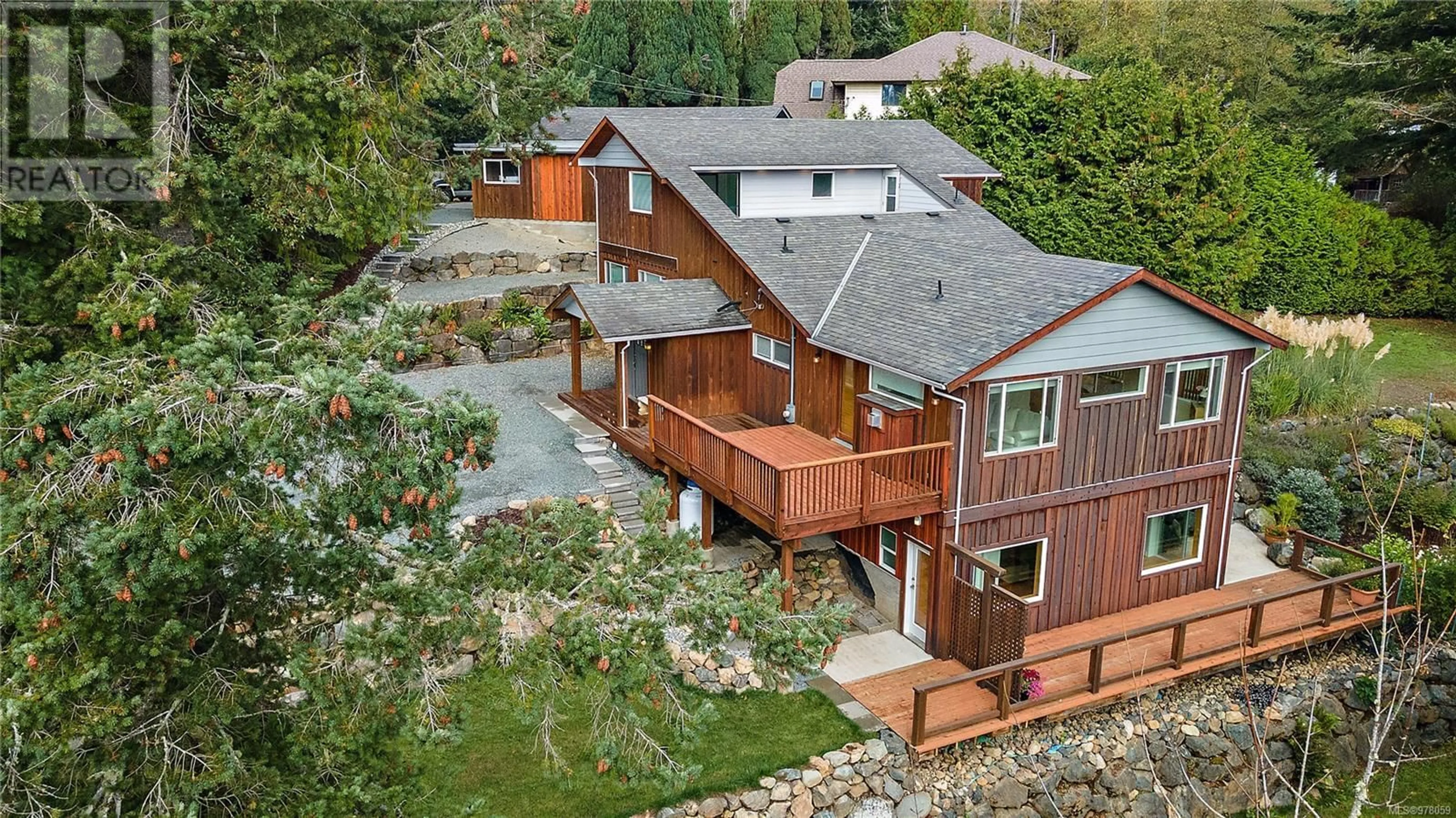 Frontside or backside of a home, the fenced backyard for 2121 Harbourview Rd, Sooke British Columbia V9Z0G5