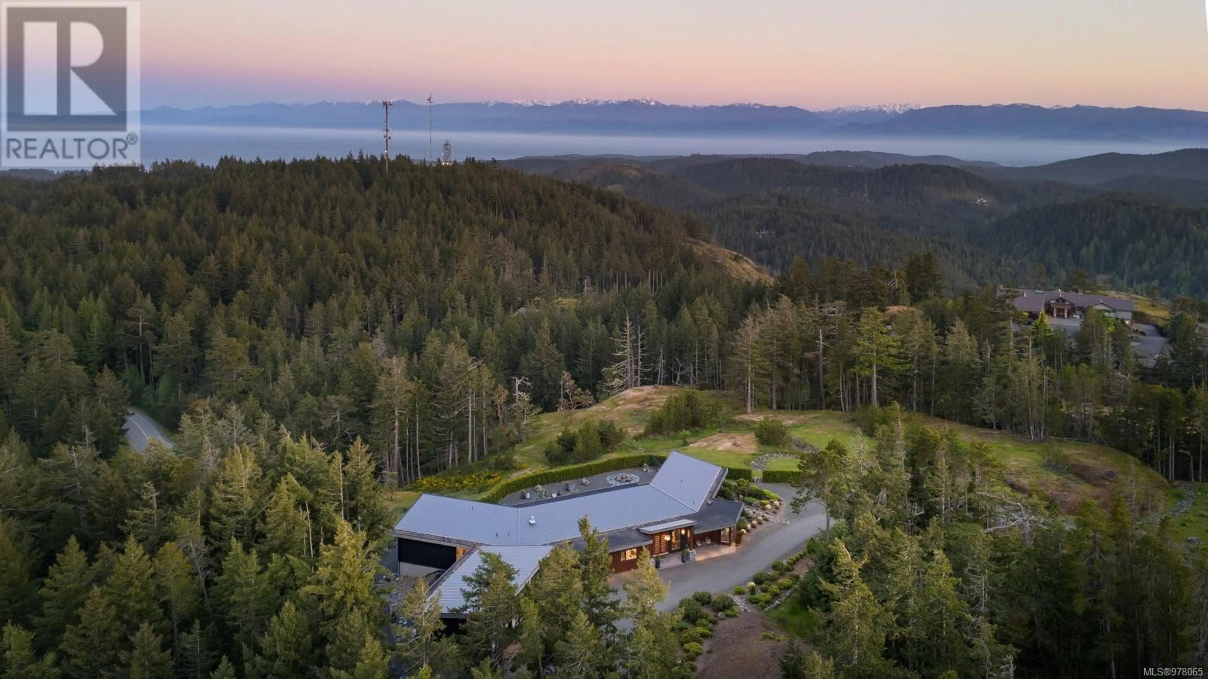 A pic from outside/outdoor area/front of a property/back of a property/a pic from drone, forest/trees view for 1570 Zanita Hts, Metchosin British Columbia V9C4H4