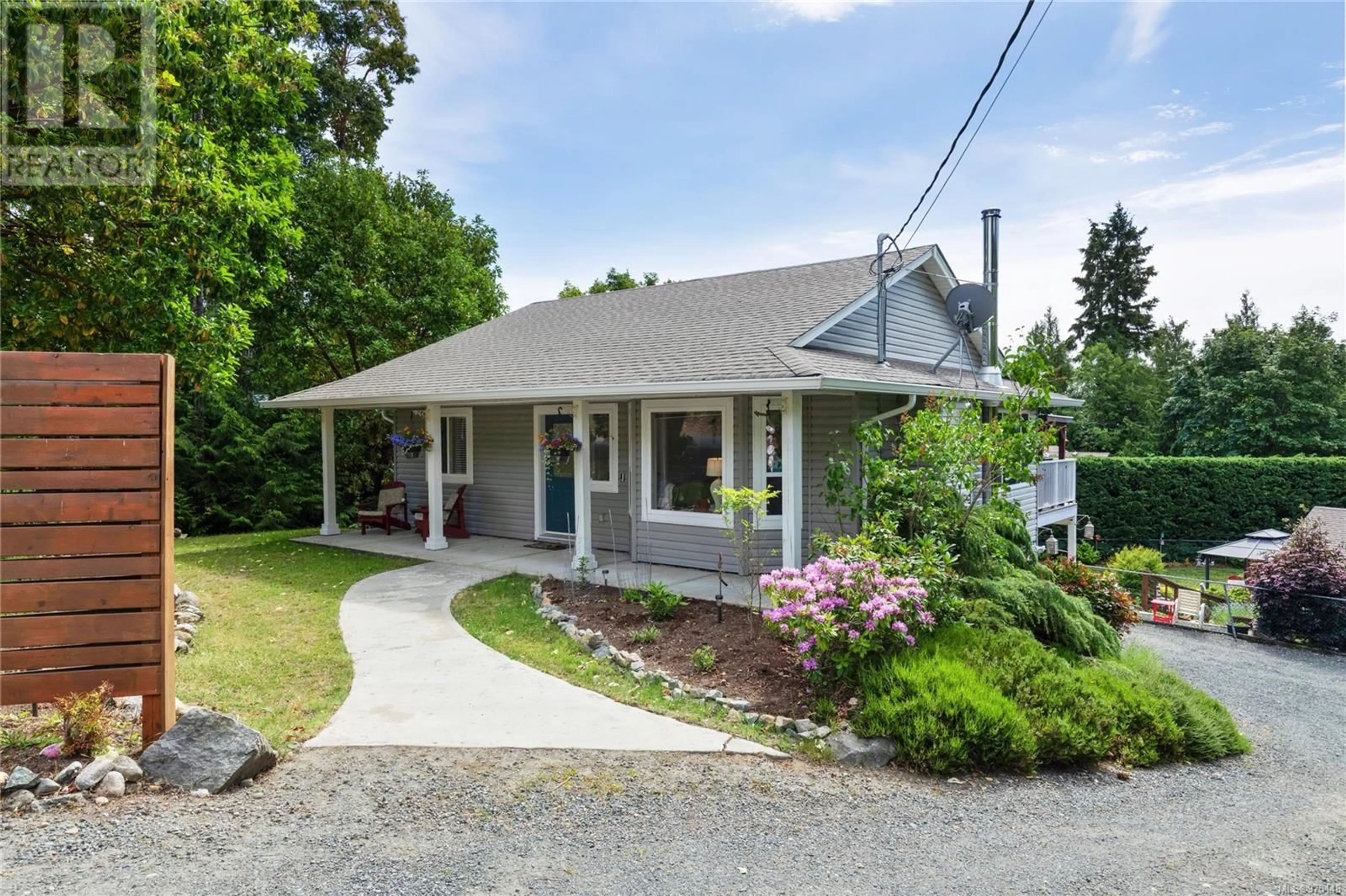 Home with vinyl exterior material, street for 1789 Country Rd, Qualicum Beach British Columbia V9K2S3