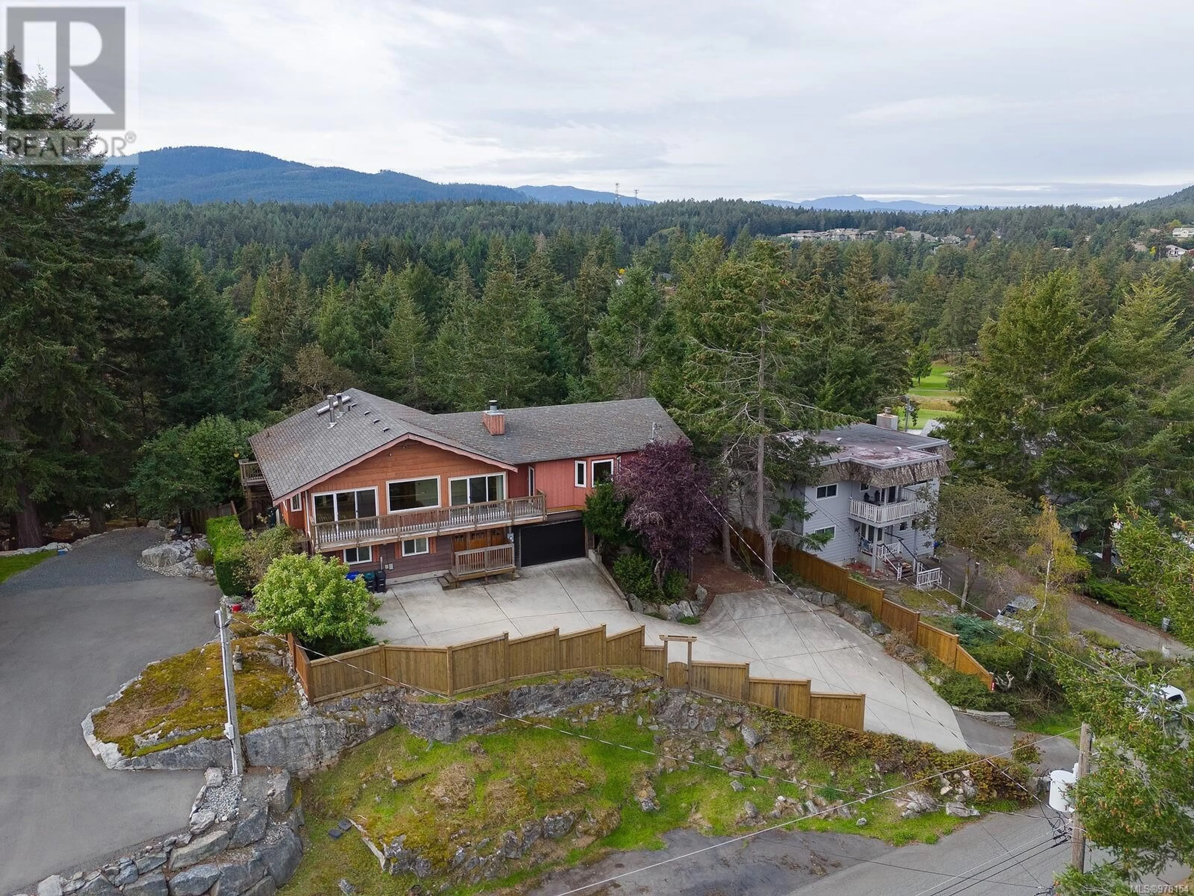 Frontside or backside of a home, the fenced backyard for 3730 Mallard Pl SE, Nanoose Bay British Columbia V9P9H1