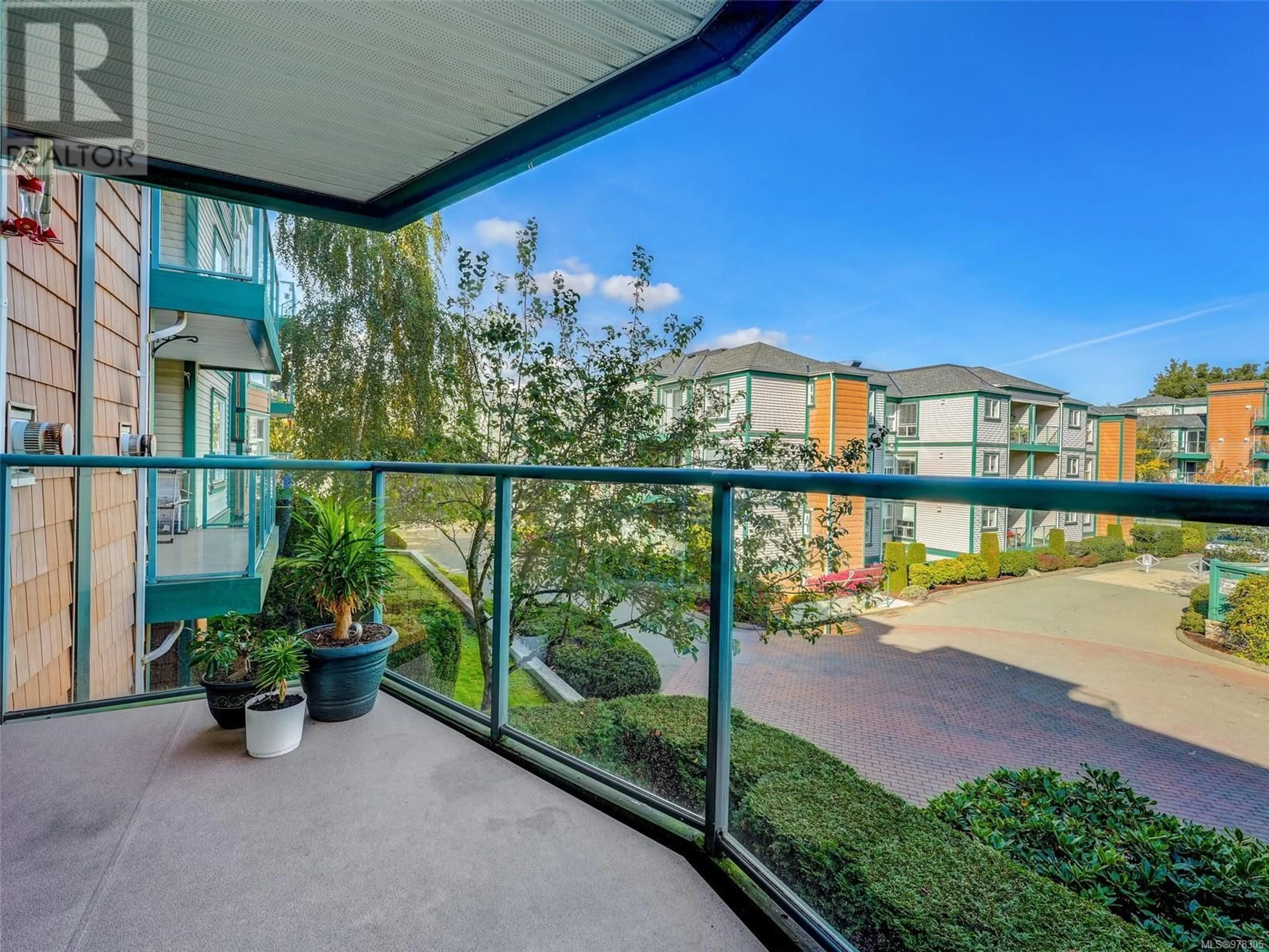 Balcony in the apartment, the fenced backyard for 212 898 Vernon Ave, Saanich British Columbia V8X2W6