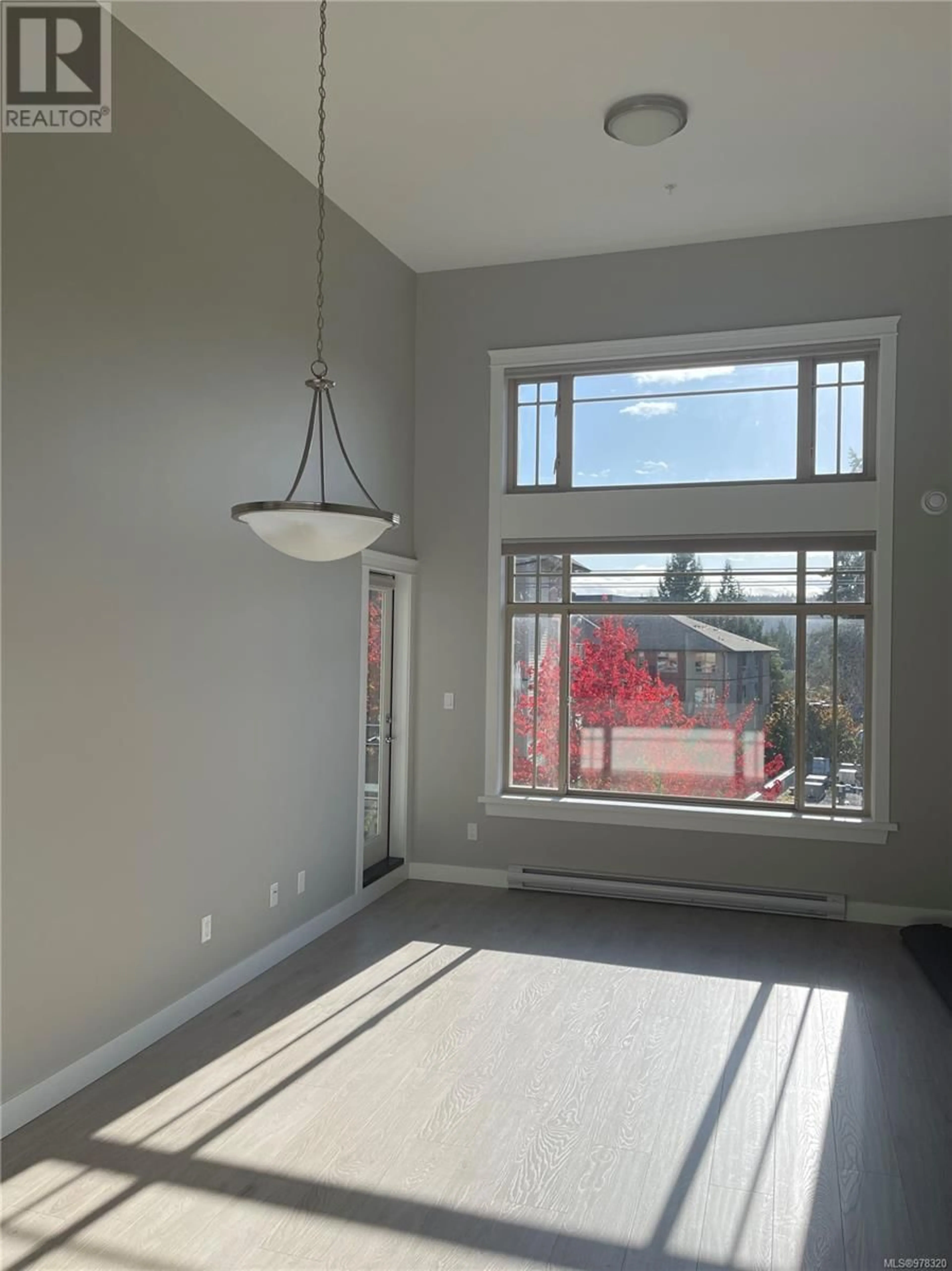 A pic of a room, wood floors for 404 844 Goldstream Ave, Langford British Columbia V9B2X7