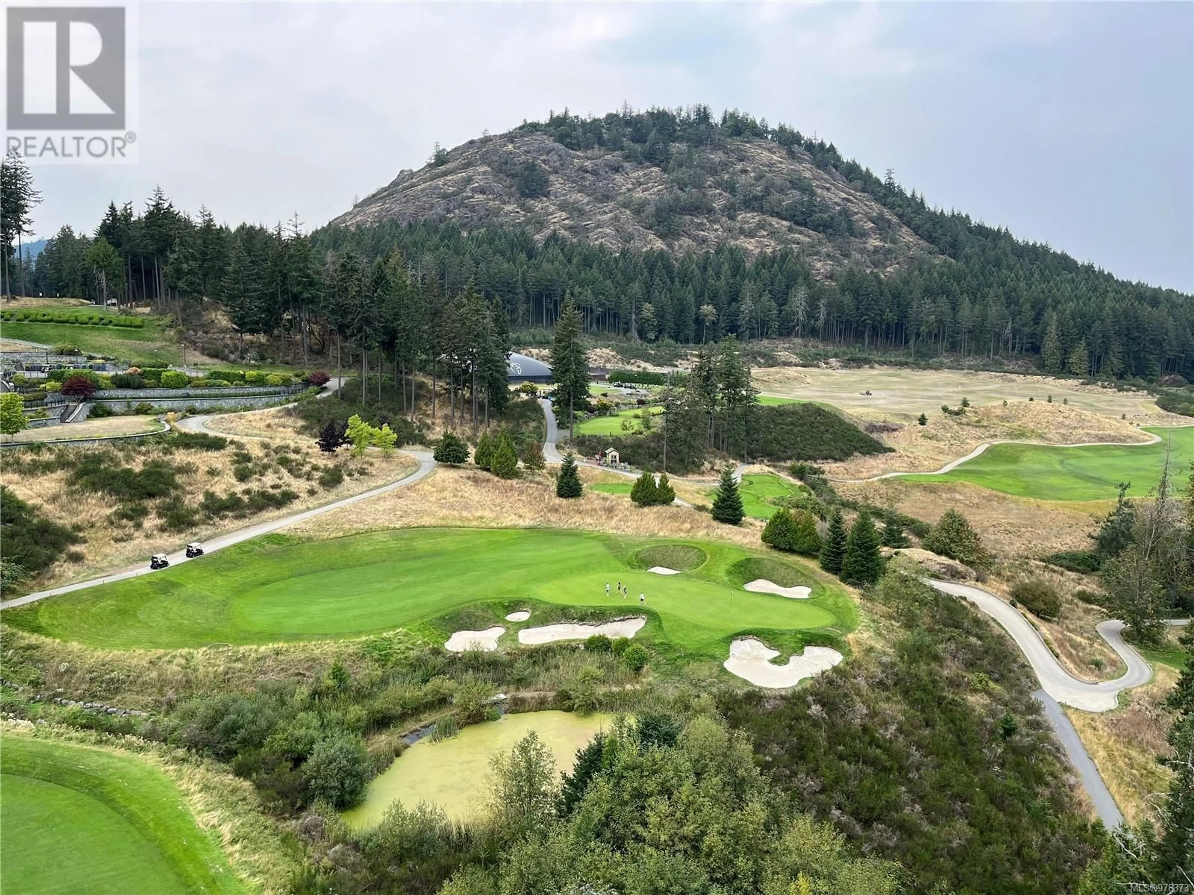 A pic from outside/outdoor area/front of a property/back of a property/a pic from drone, mountain view for 706 - 2000 HANNINGTON ROAD, Langford British Columbia V9B9C1