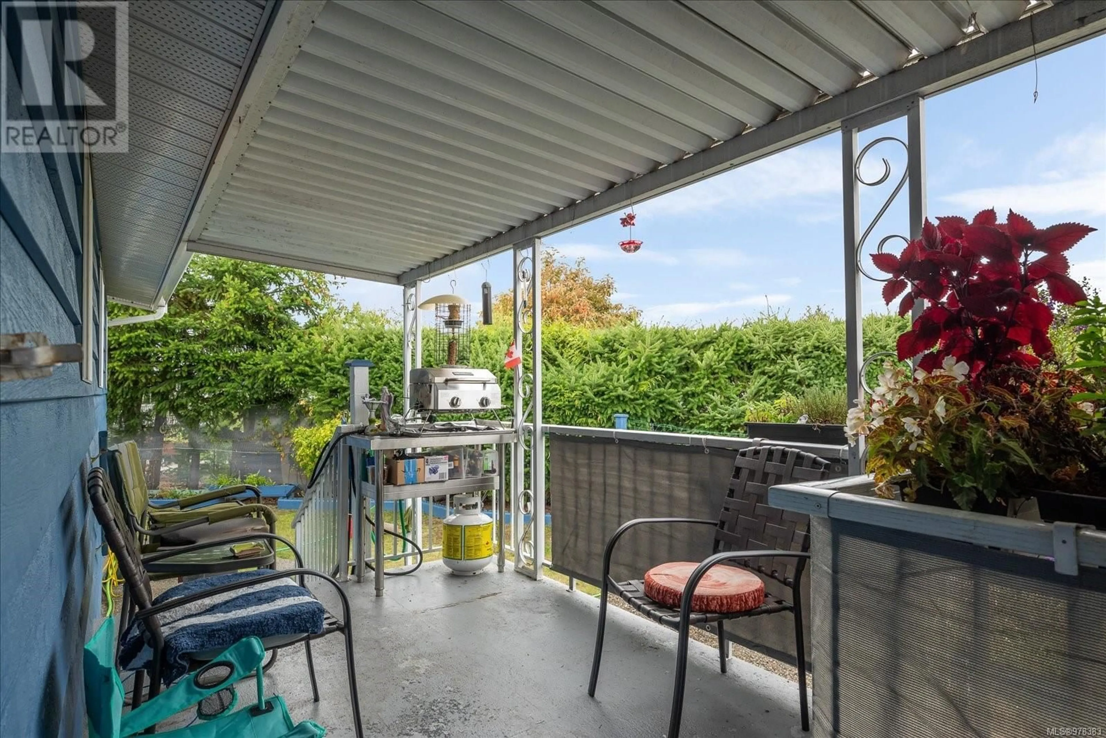 Patio, the fenced backyard for 98 6325 Metral Dr, Nanaimo British Columbia V9T6P9