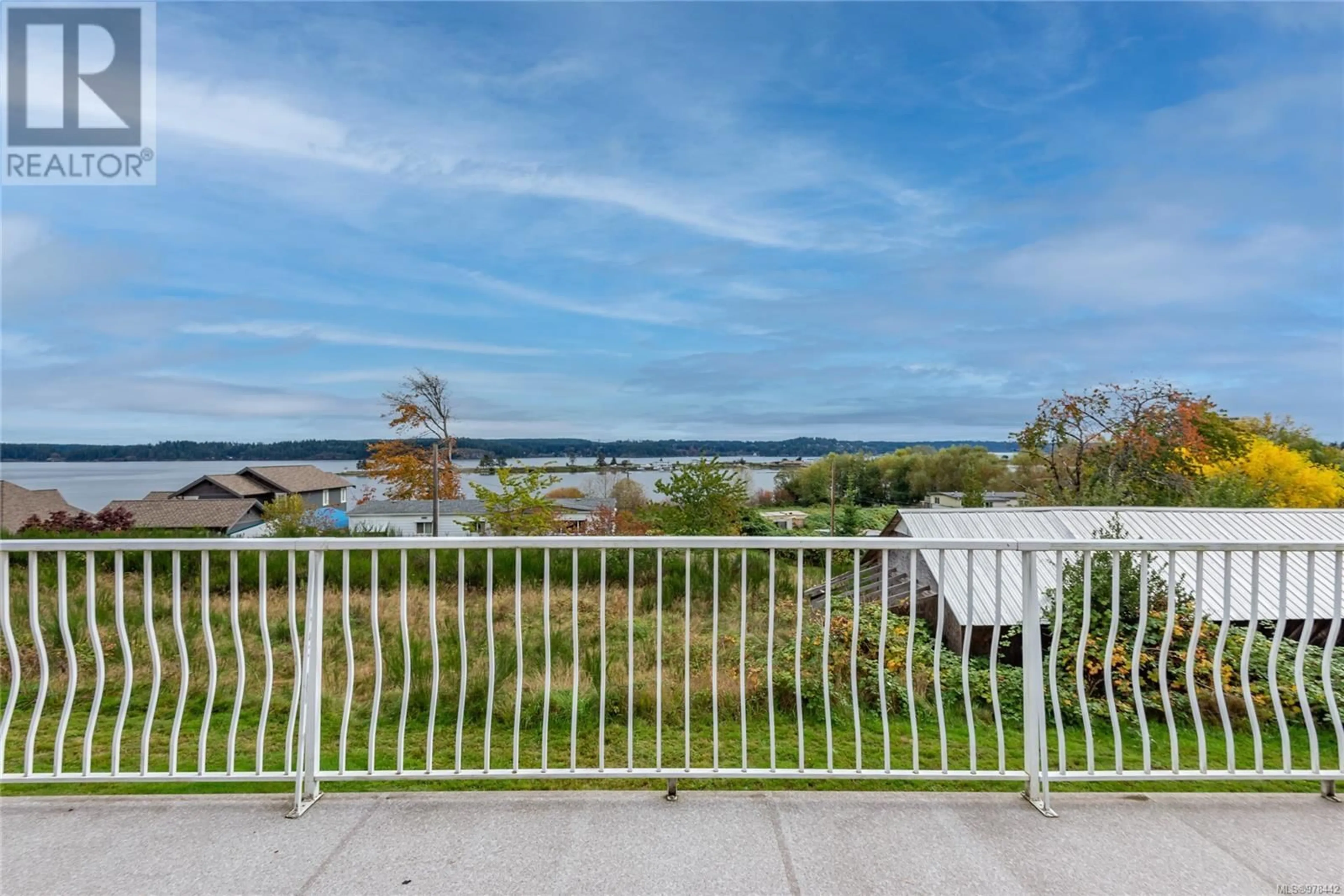 A pic from exterior of the house or condo, the fenced backyard for 1573 Perth Rd, Campbell River British Columbia V9W1G4