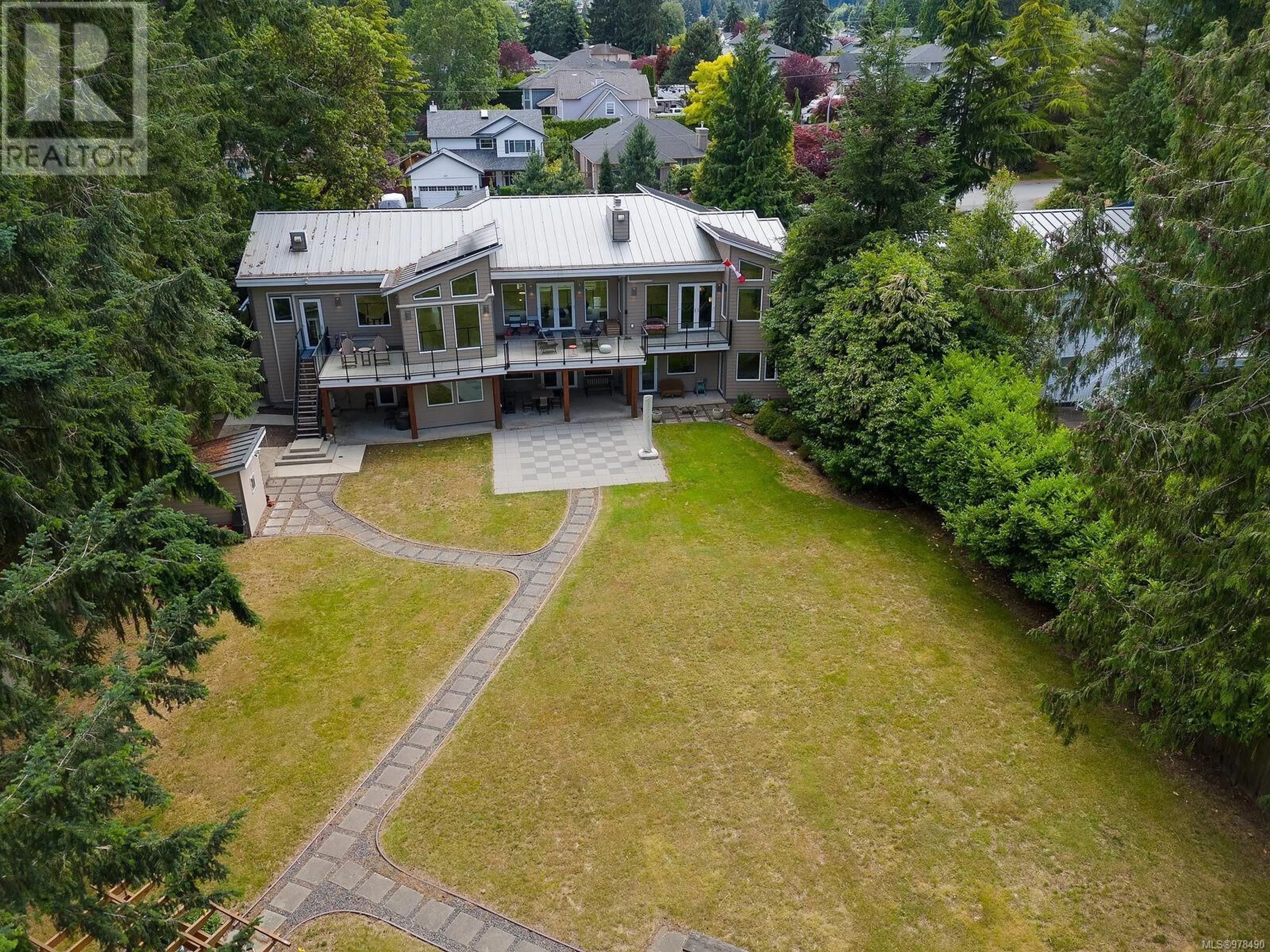 A pic from outside/outdoor area/front of a property/back of a property/a pic from drone, mountain view for 5912 WALDBANK ROAD, Nanaimo British Columbia V9V1C8