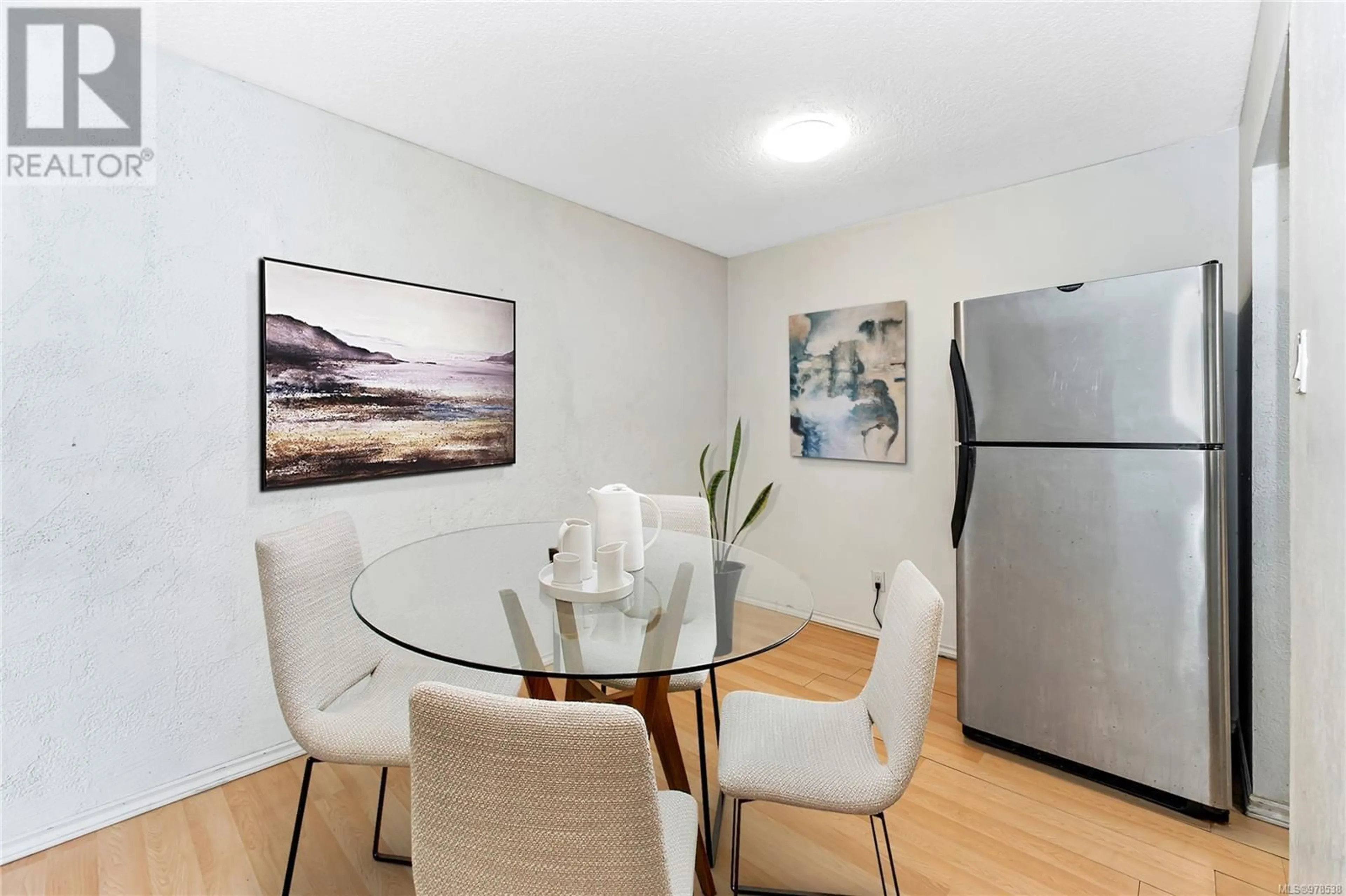 Dining room, wood/laminate floor for 107 1870 McKenzie Ave, Saanich British Columbia V8N1X3