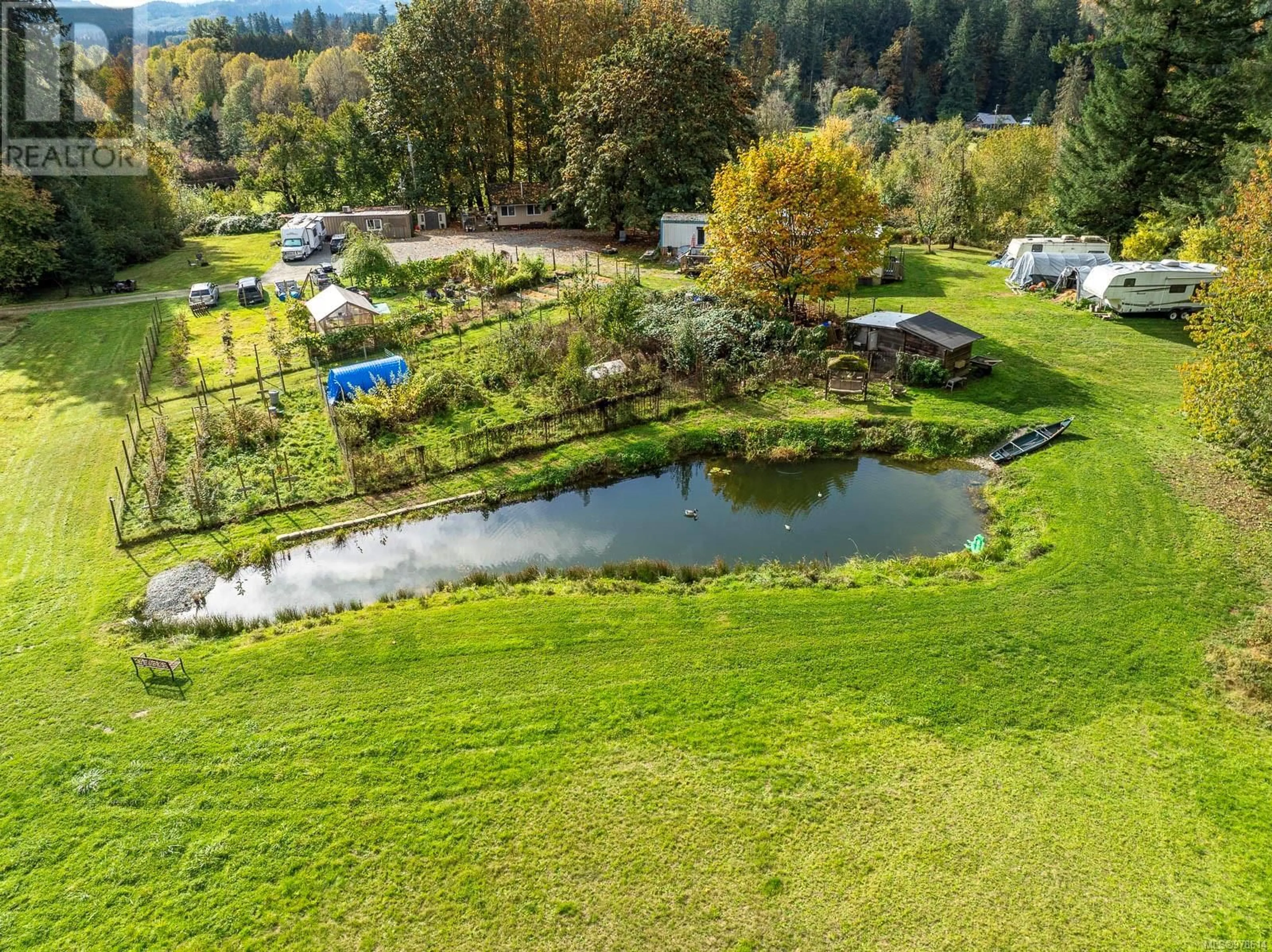 A pic from exterior of the house or condo, the fenced backyard for 6979 Hills Rd, Port Alberni British Columbia V9Y8L4