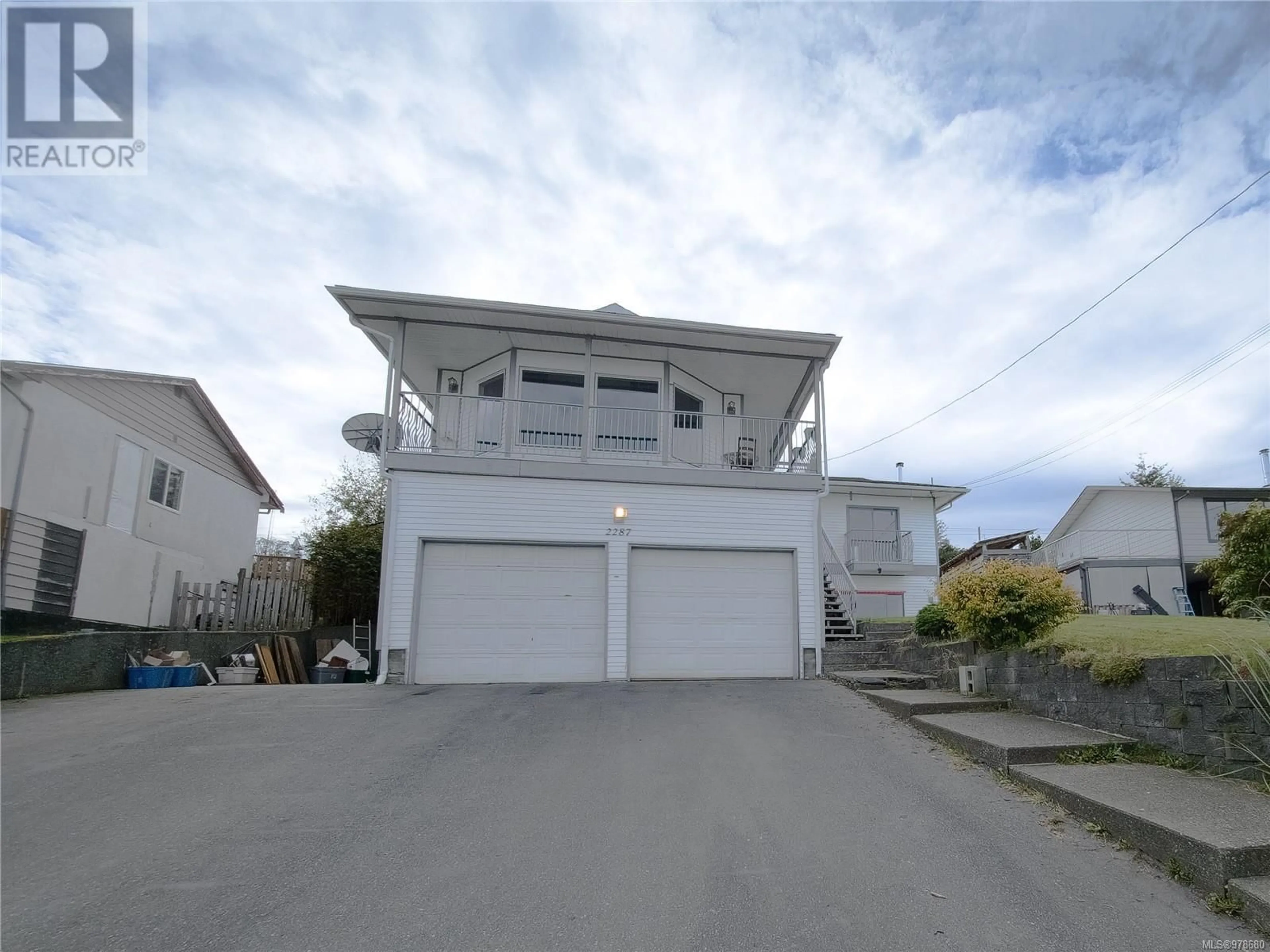 A pic from exterior of the house or condo, the street view for 2287 Chelohsin Cres, Port McNeill British Columbia V0N2R0