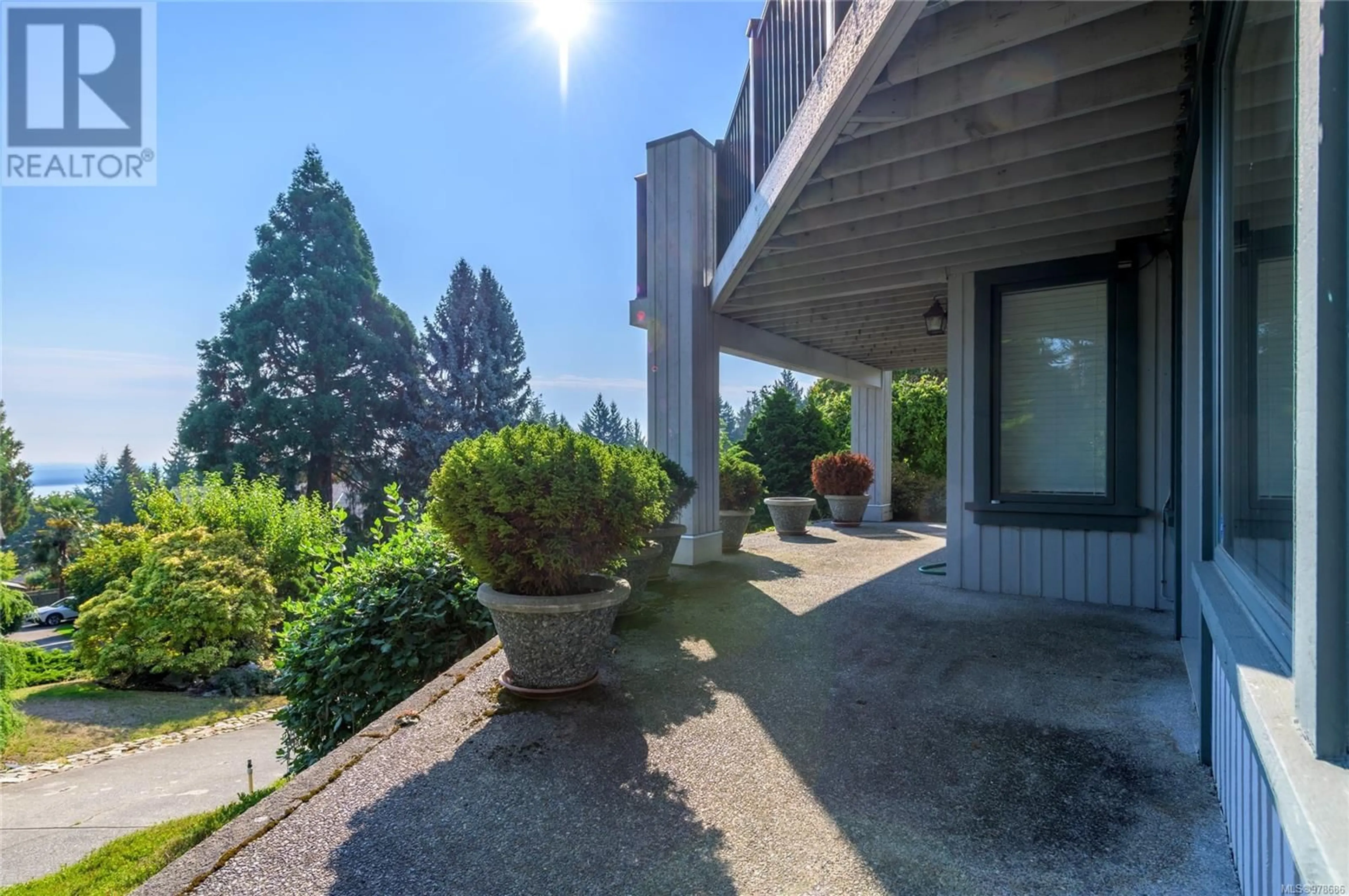 A pic from exterior of the house or condo, the street view for 8742 Pender Park Dr, North Saanich British Columbia V8L3Z5