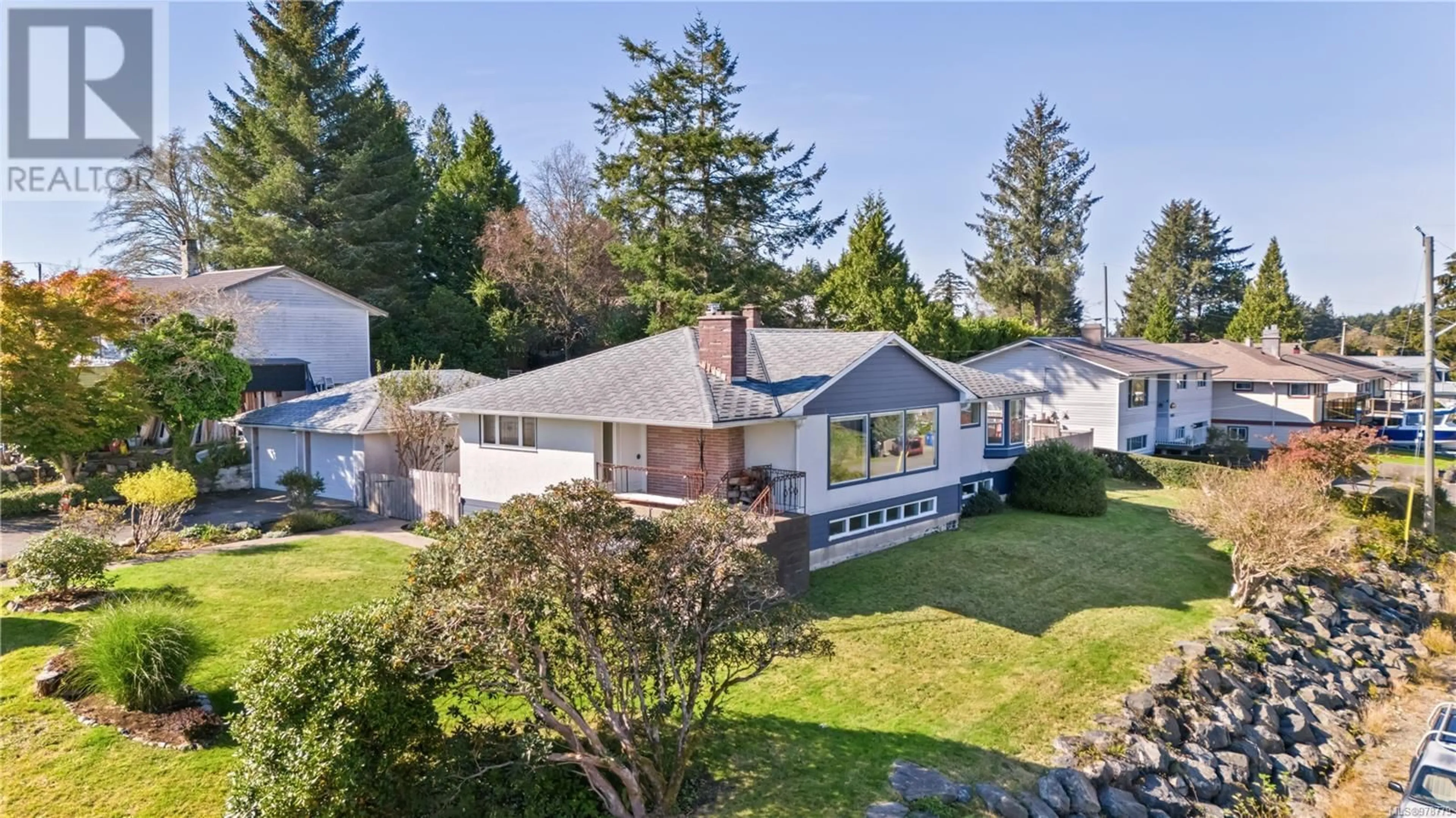 Frontside or backside of a home, the fenced backyard for 231 Otter St, Ucluelet British Columbia V0R3A0