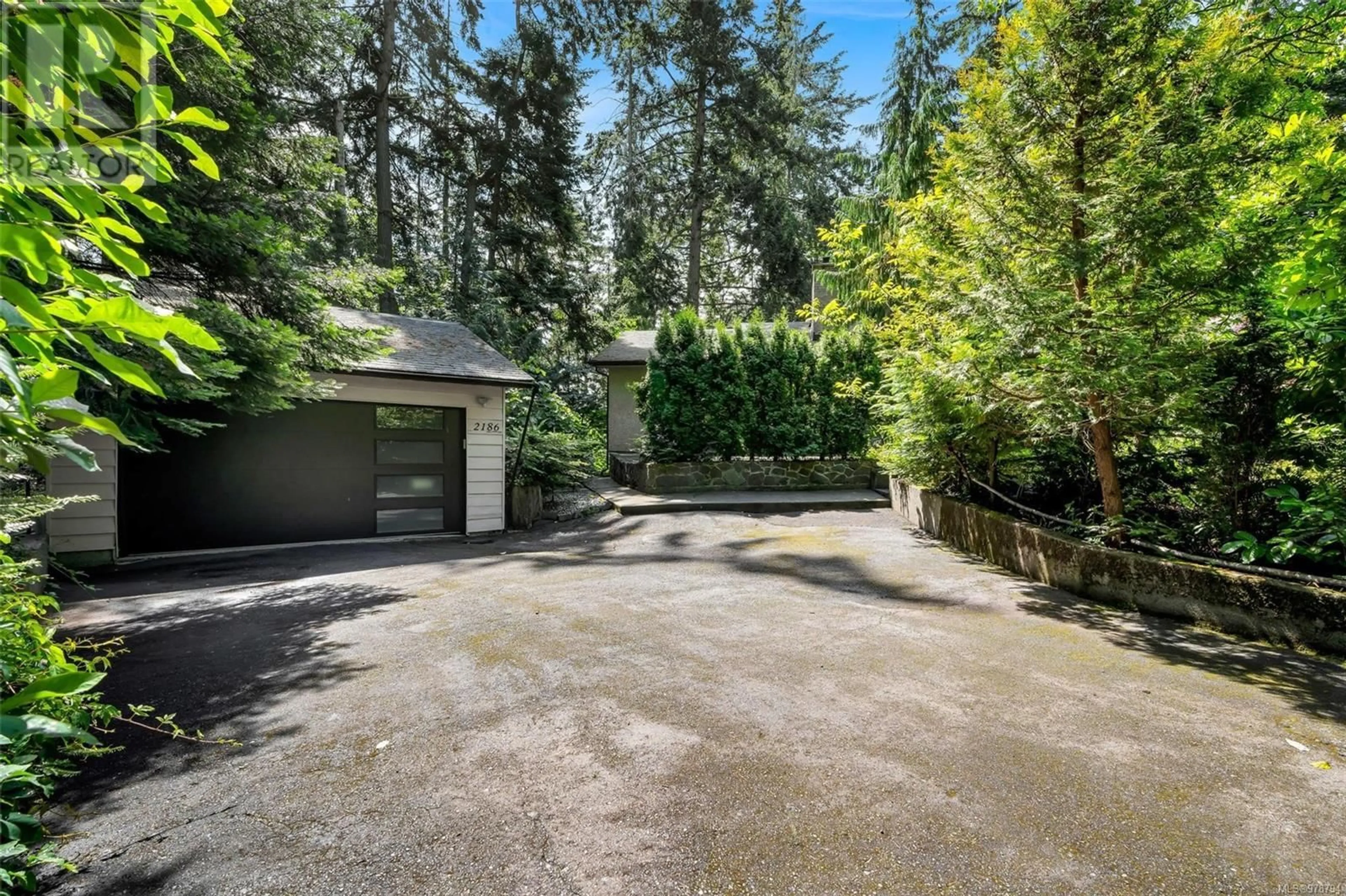 A pic from exterior of the house or condo, the fenced backyard for 2186 Neptune Rd, North Saanich British Columbia V8L3R9