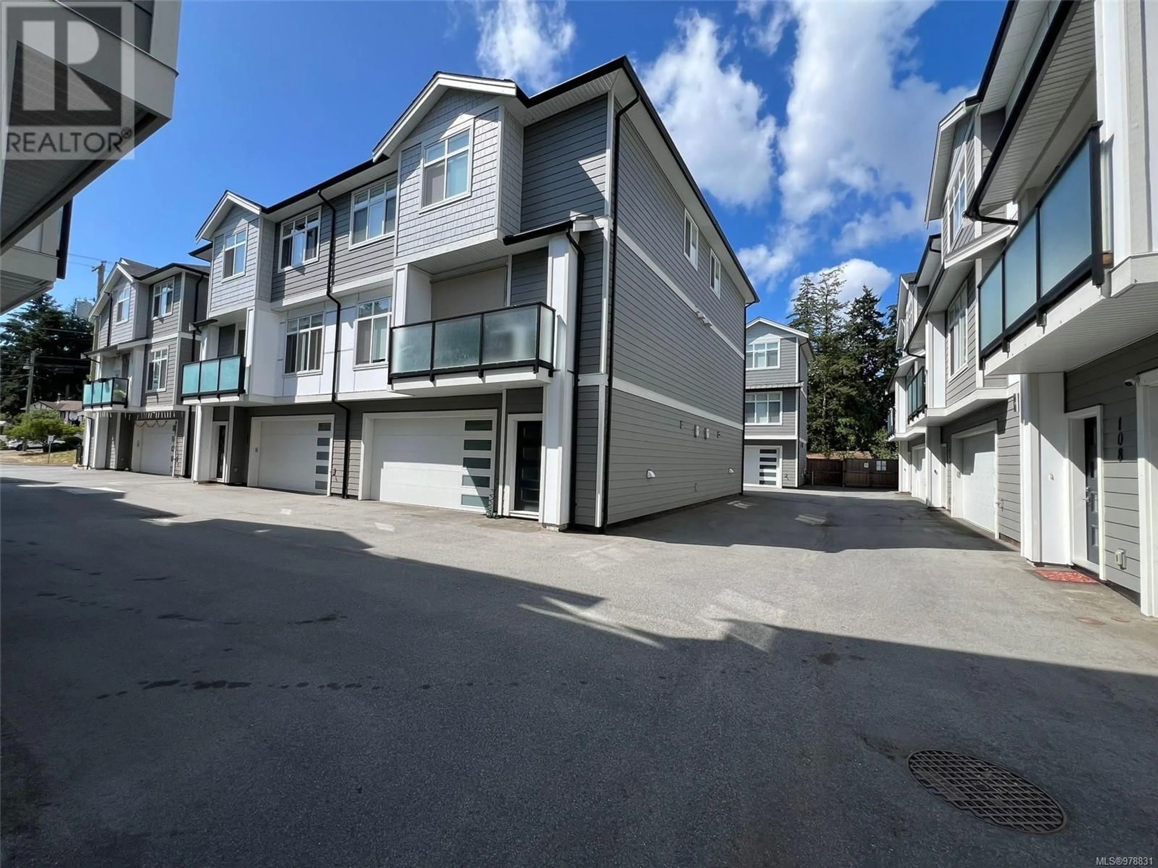 A pic from exterior of the house or condo, the fenced backyard for 103 946 Jenkins Ave, Langford British Columbia V9B2N7