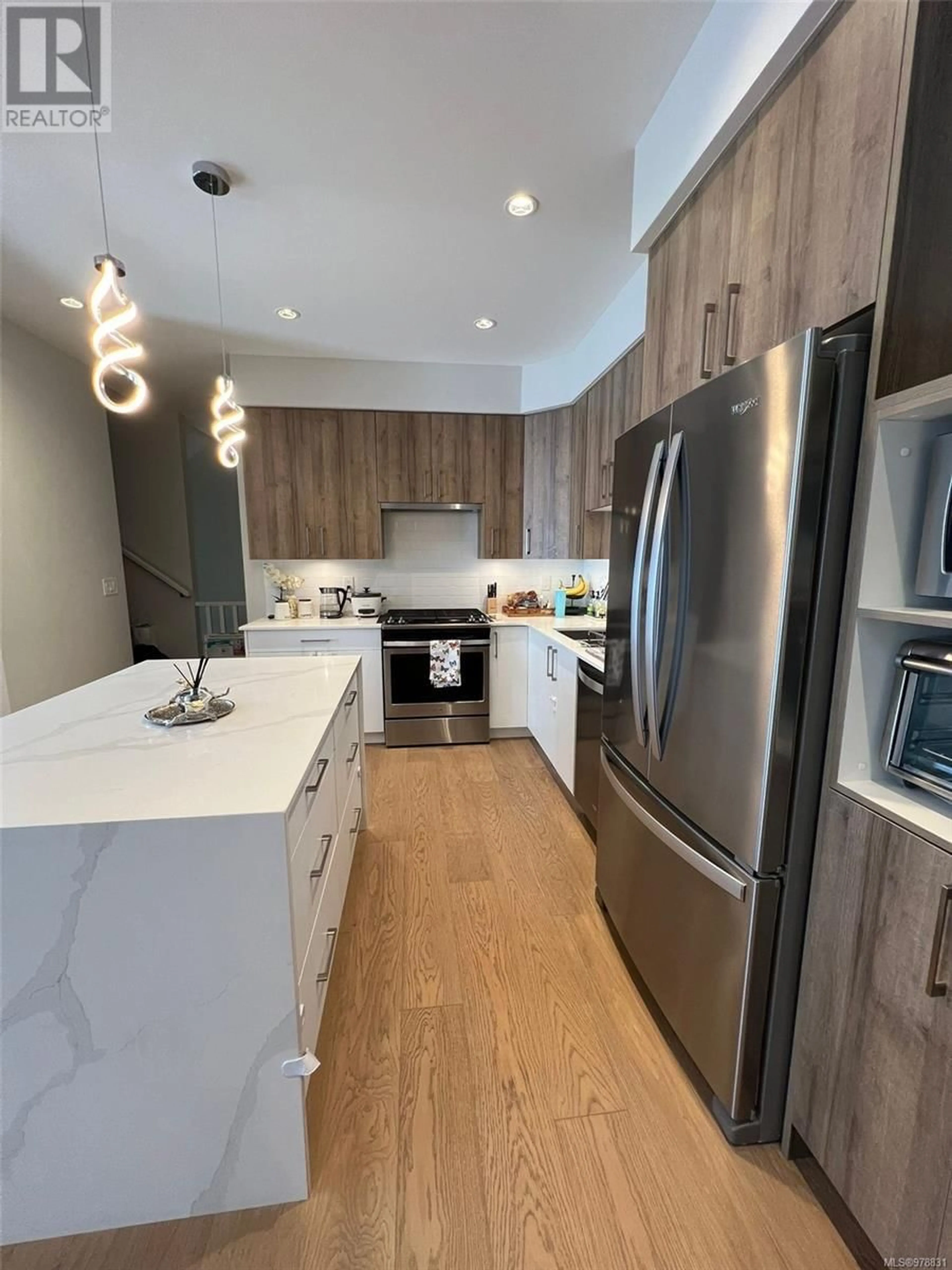 Contemporary kitchen, wood floors for 103 946 Jenkins Ave, Langford British Columbia V9B2N7