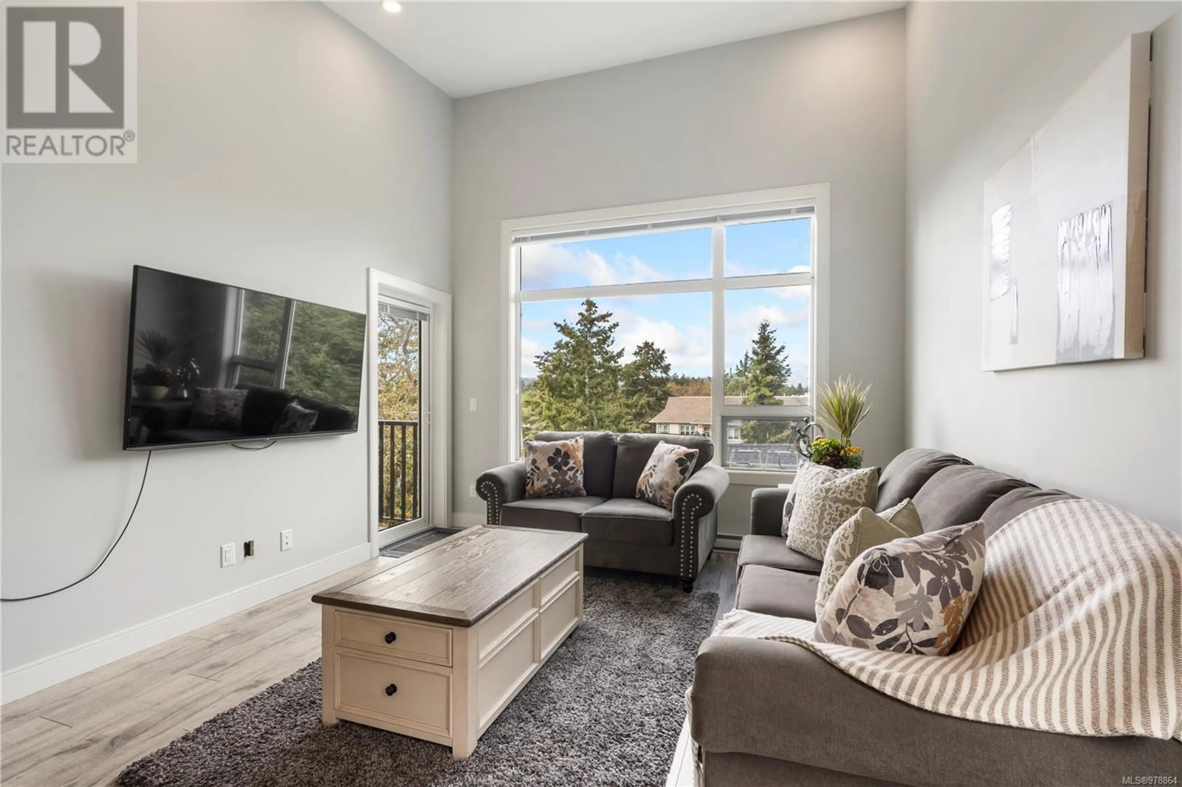 Living room, wood floors for 405 280 Island Hwy, View Royal British Columbia V9B1G5