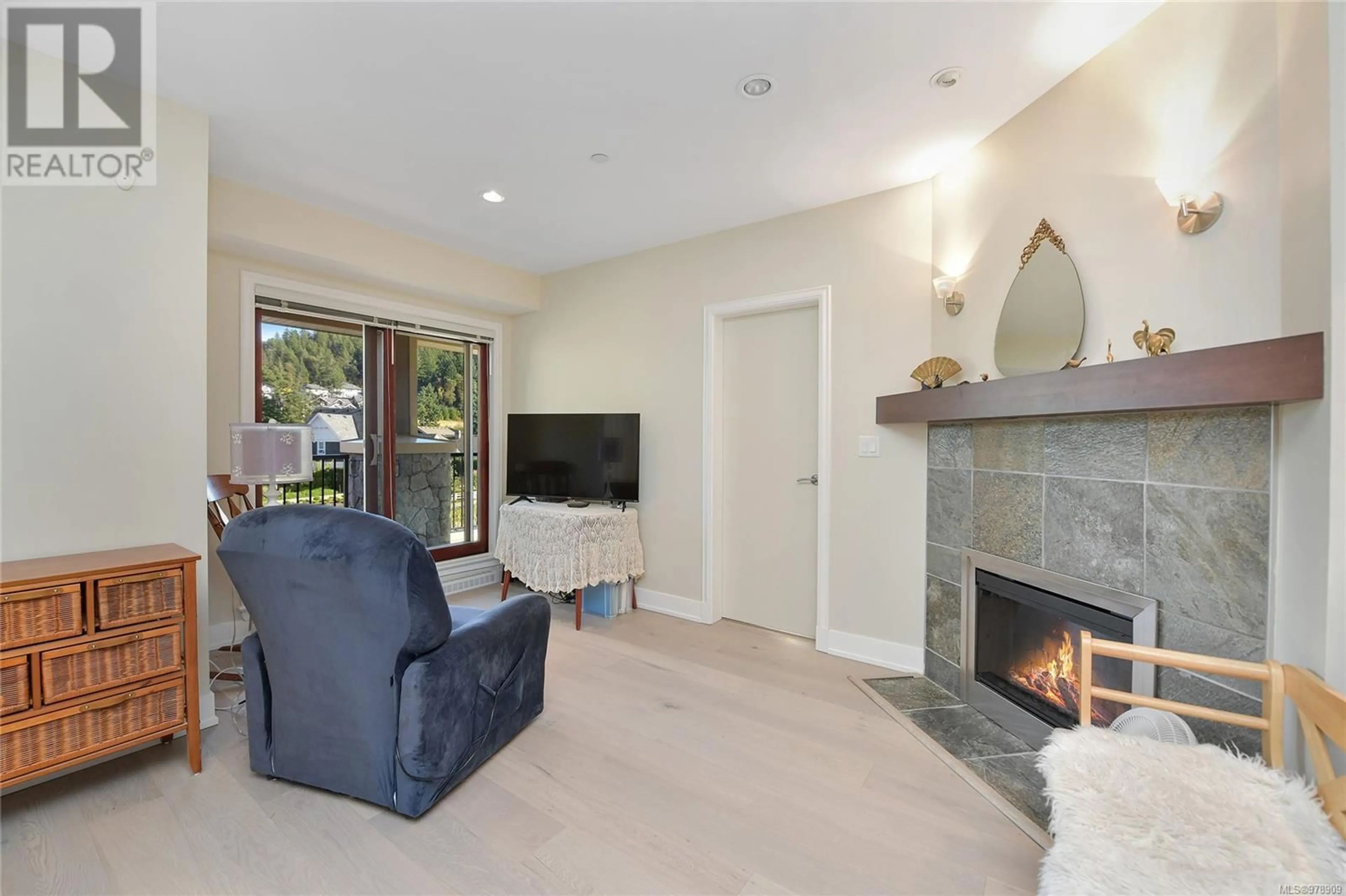 Living room, wood floors for 220 1325 Bear Mountain Pkwy, Langford British Columbia V9B6T8