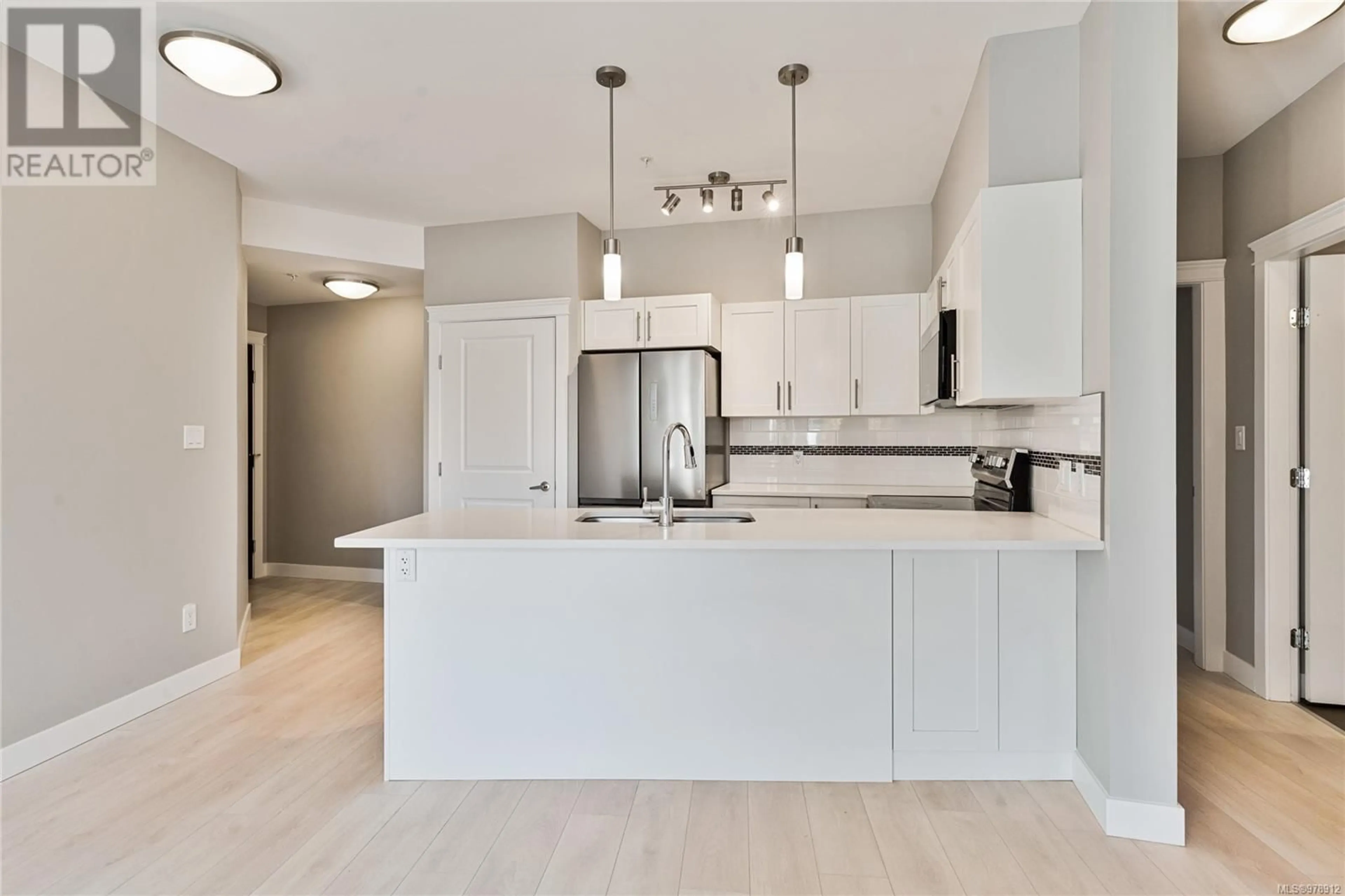 Open concept kitchen for 204 844 Goldstream Ave, Langford British Columbia V9B2X8