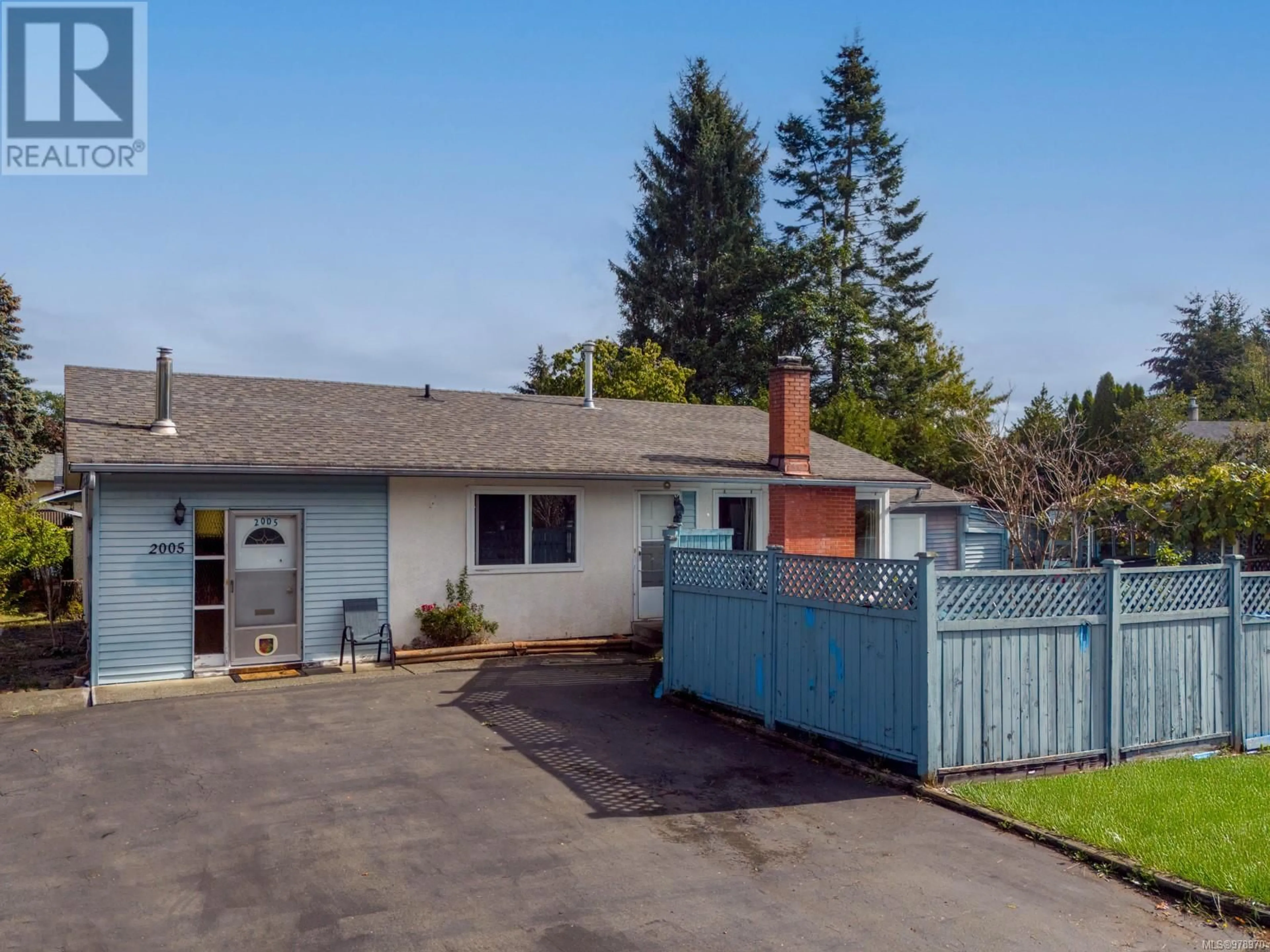 Frontside or backside of a home, the fenced backyard for 2005 Hemlock Pl, Courtenay British Columbia V9N3B9