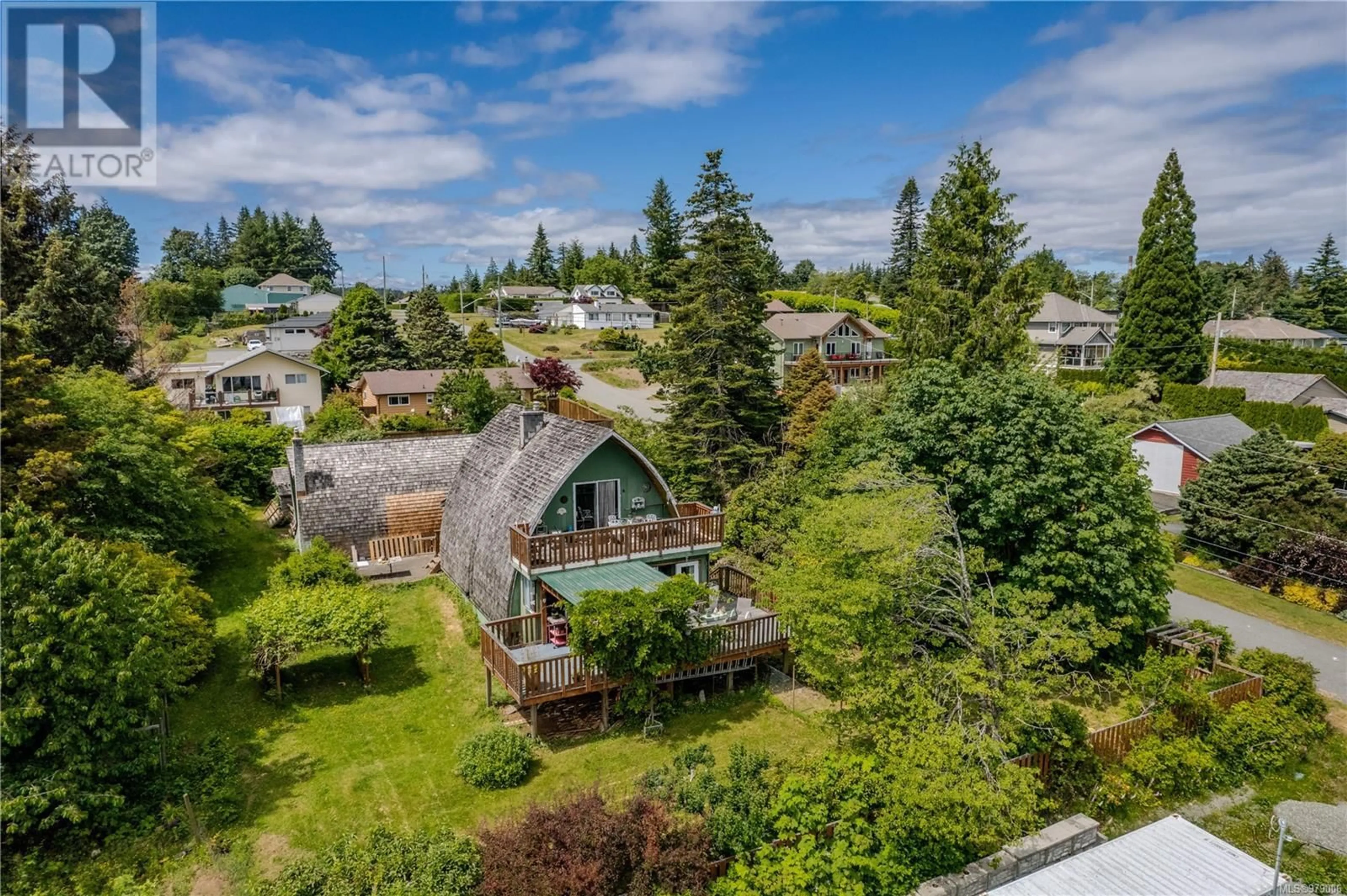 A pic from exterior of the house or condo, the fenced backyard for 1710 Wood Rd, Campbell River British Columbia V9W4T6