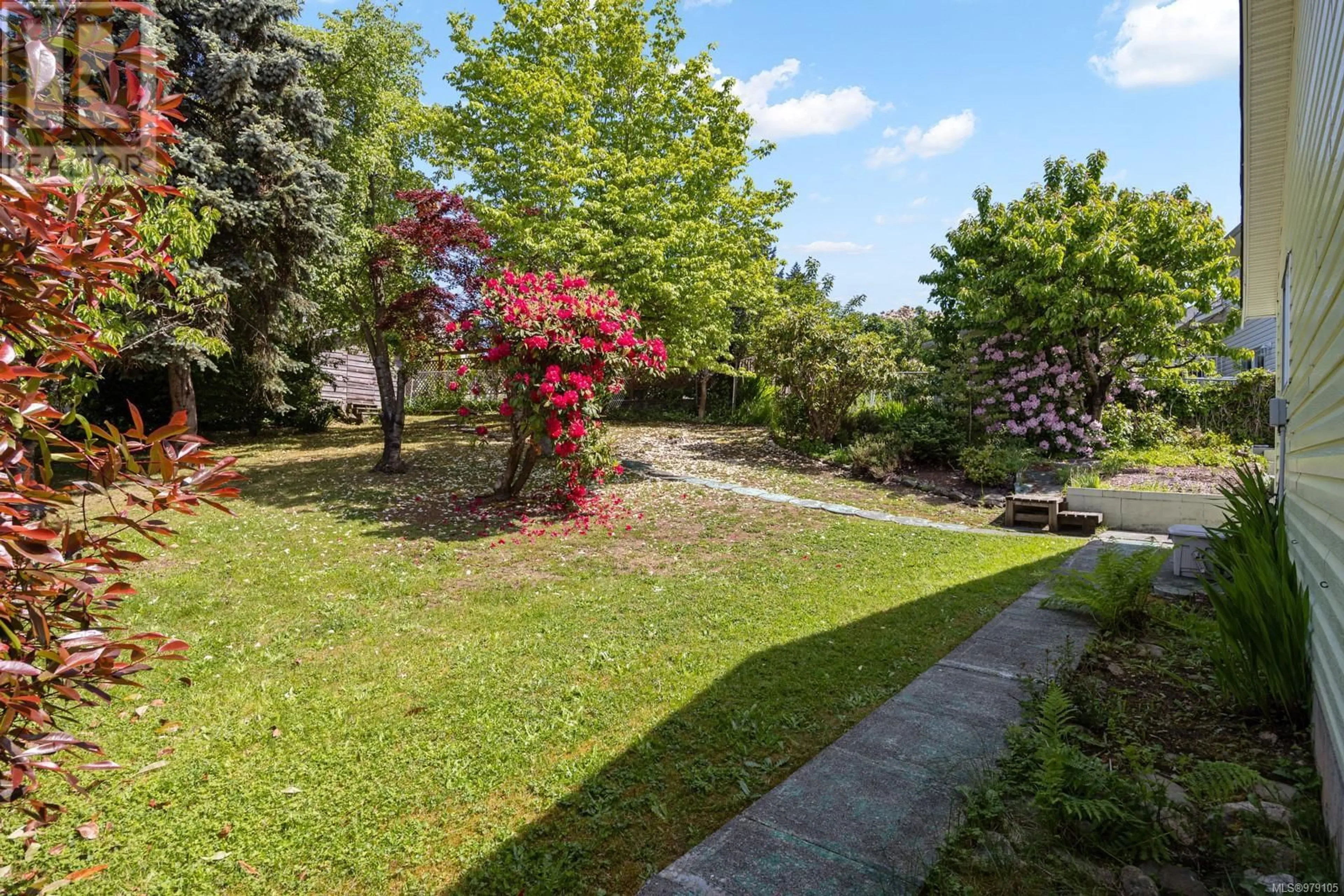 Patio, the fenced backyard for 1441 Malahat Dr, Courtenay British Columbia V9N8H3