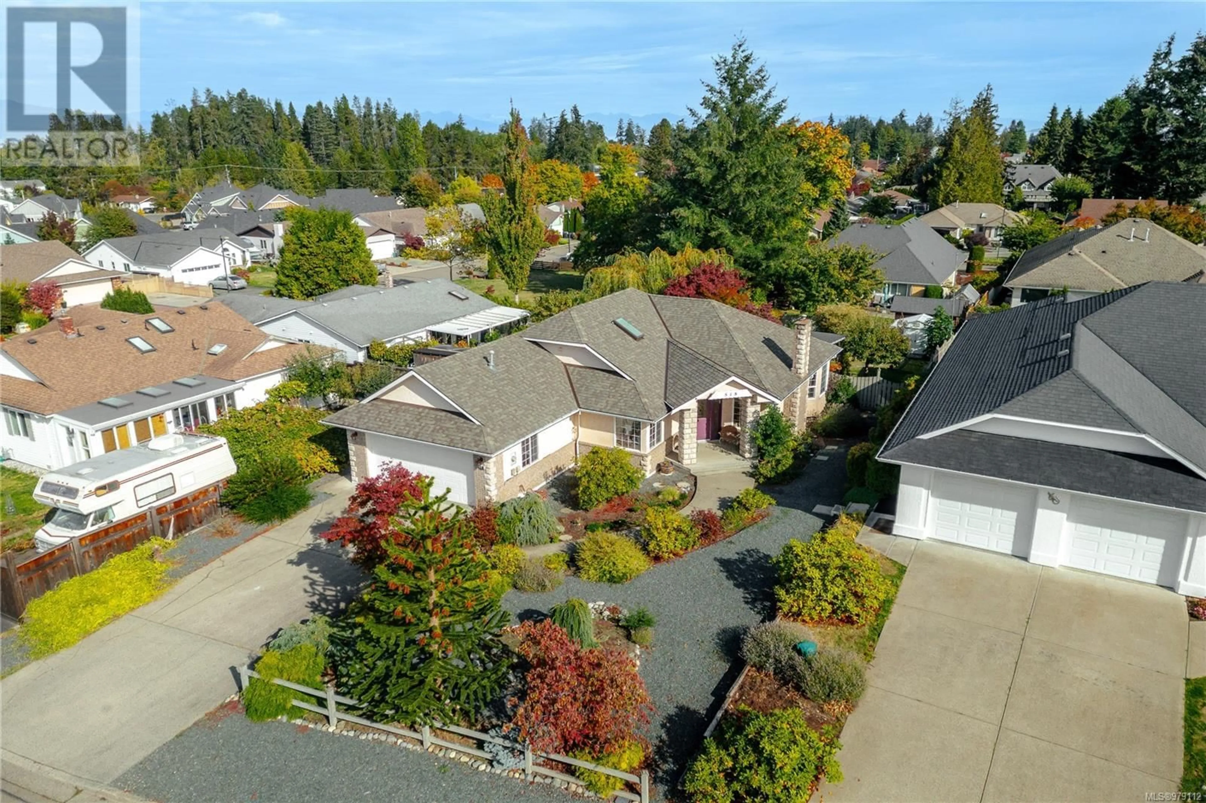 Frontside or backside of a home, the fenced backyard for 518 Belson St, Parksville British Columbia V9P2P9