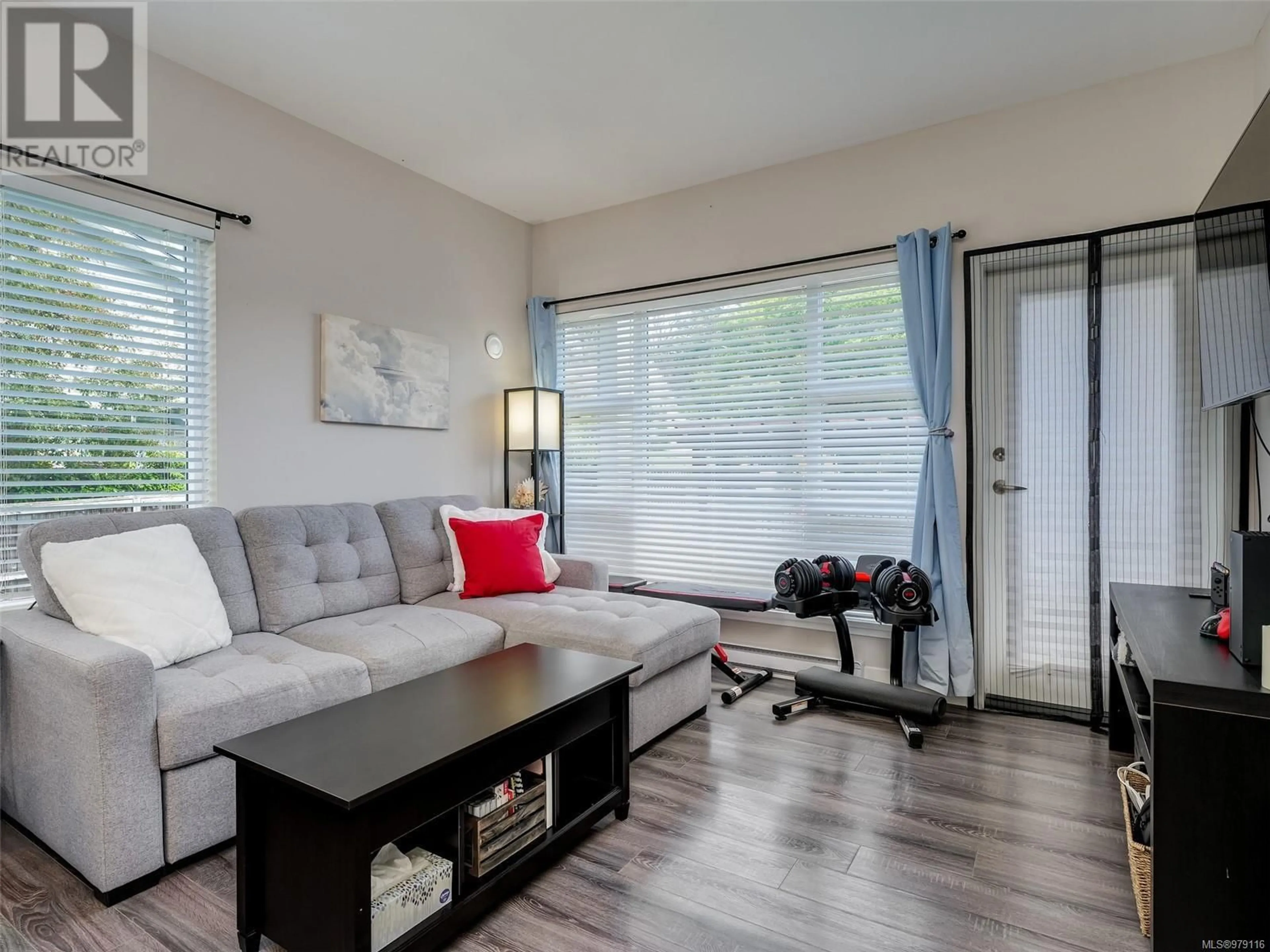 Living room, wood floors for 303 1018 Inverness Rd, Saanich British Columbia V8X2S1