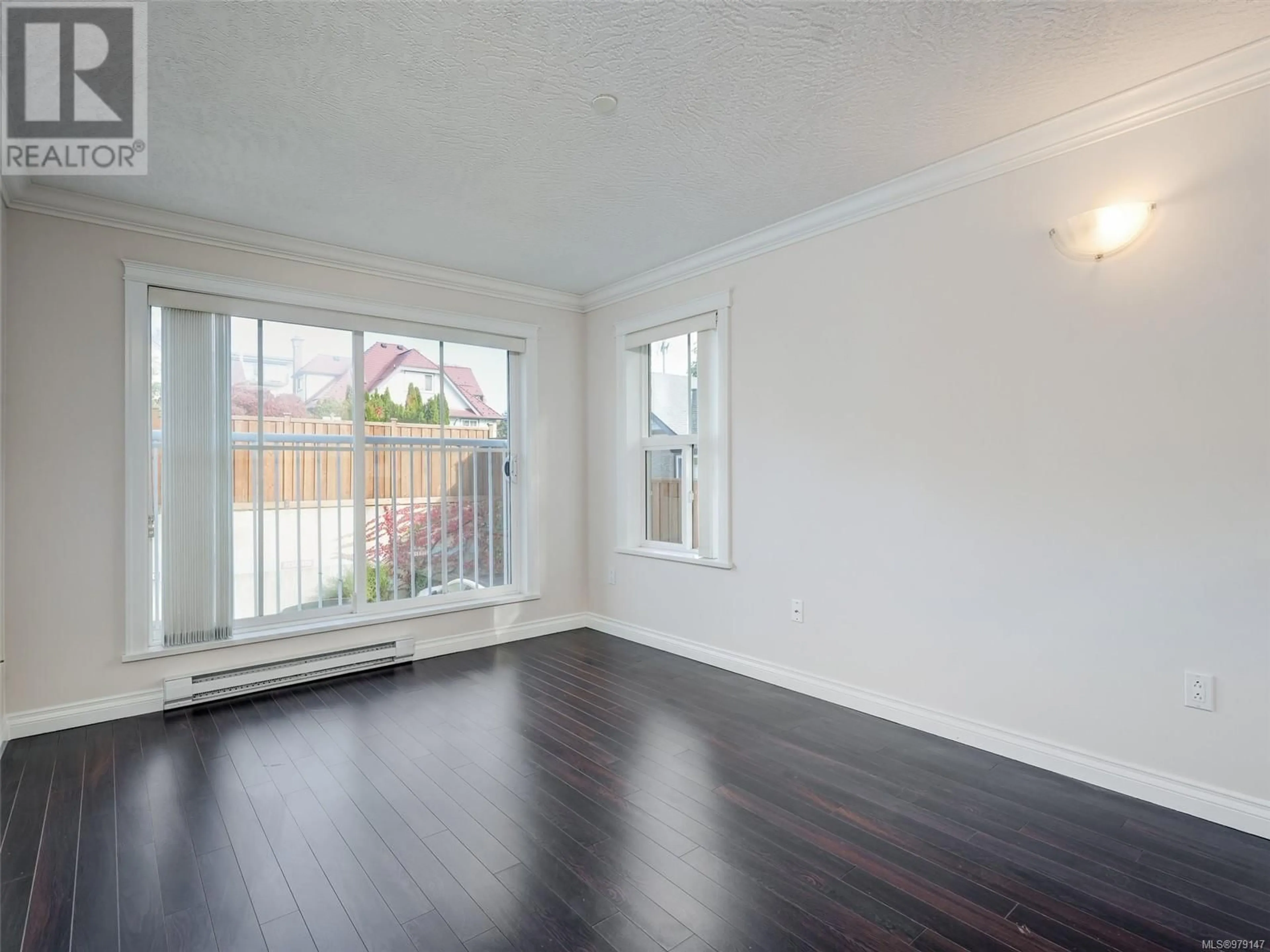 A pic of a room, wood floors for 202 1070 Southgate St, Victoria British Columbia V8V2Z2