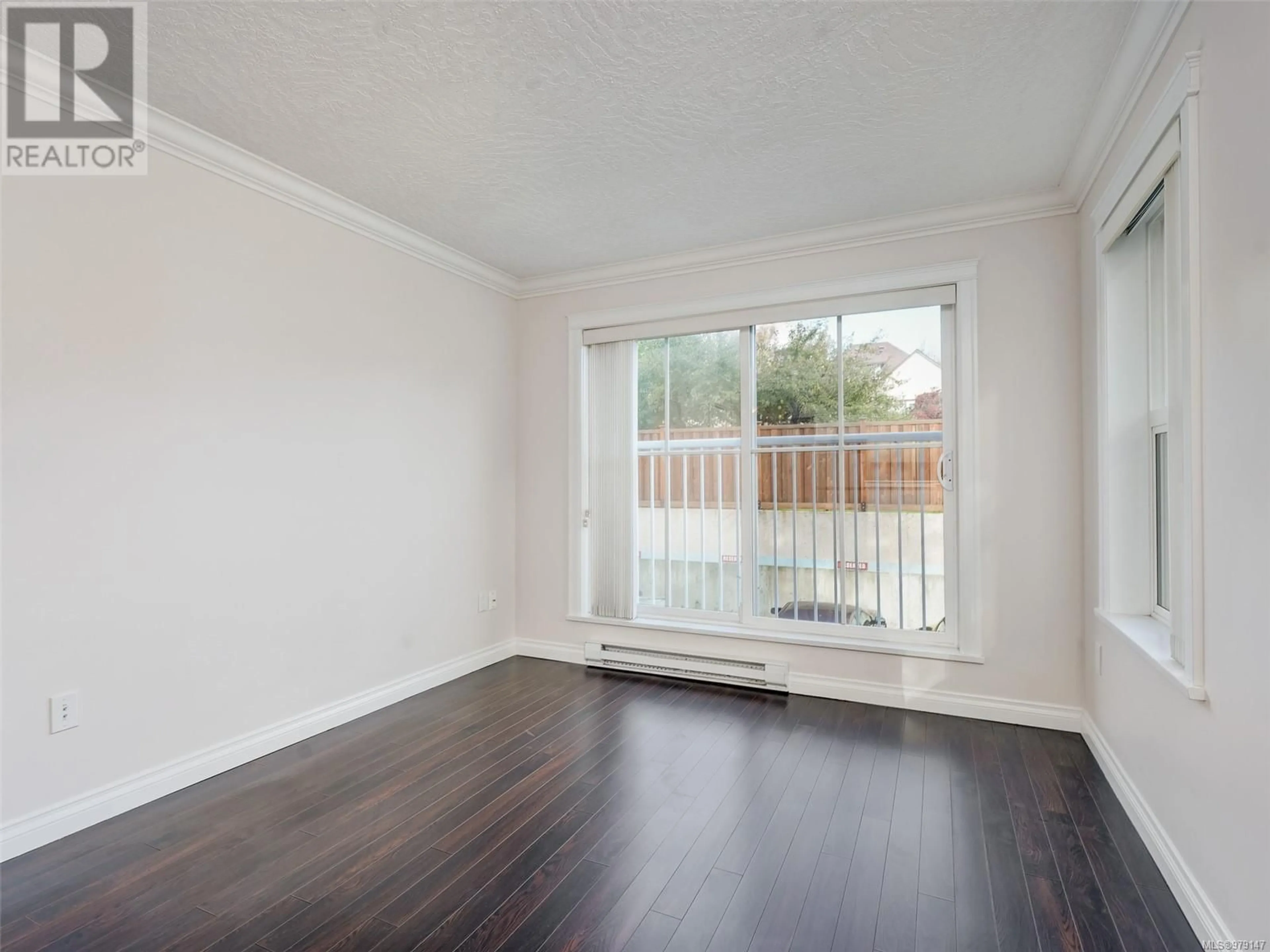 A pic of a room, wood floors for 202 1070 Southgate St, Victoria British Columbia V8V2Z2