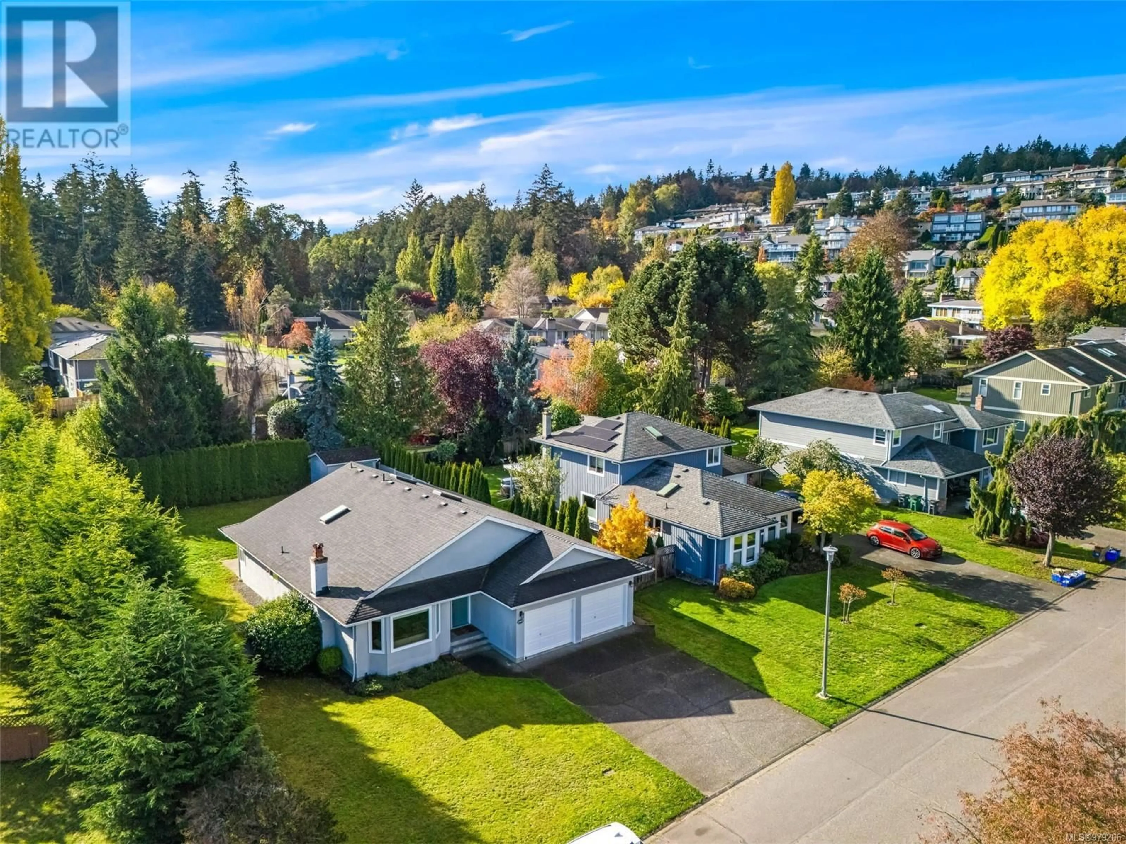 Frontside or backside of a home, the fenced backyard for 1017 Symphony Pl, Saanich British Columbia V8Y2W2