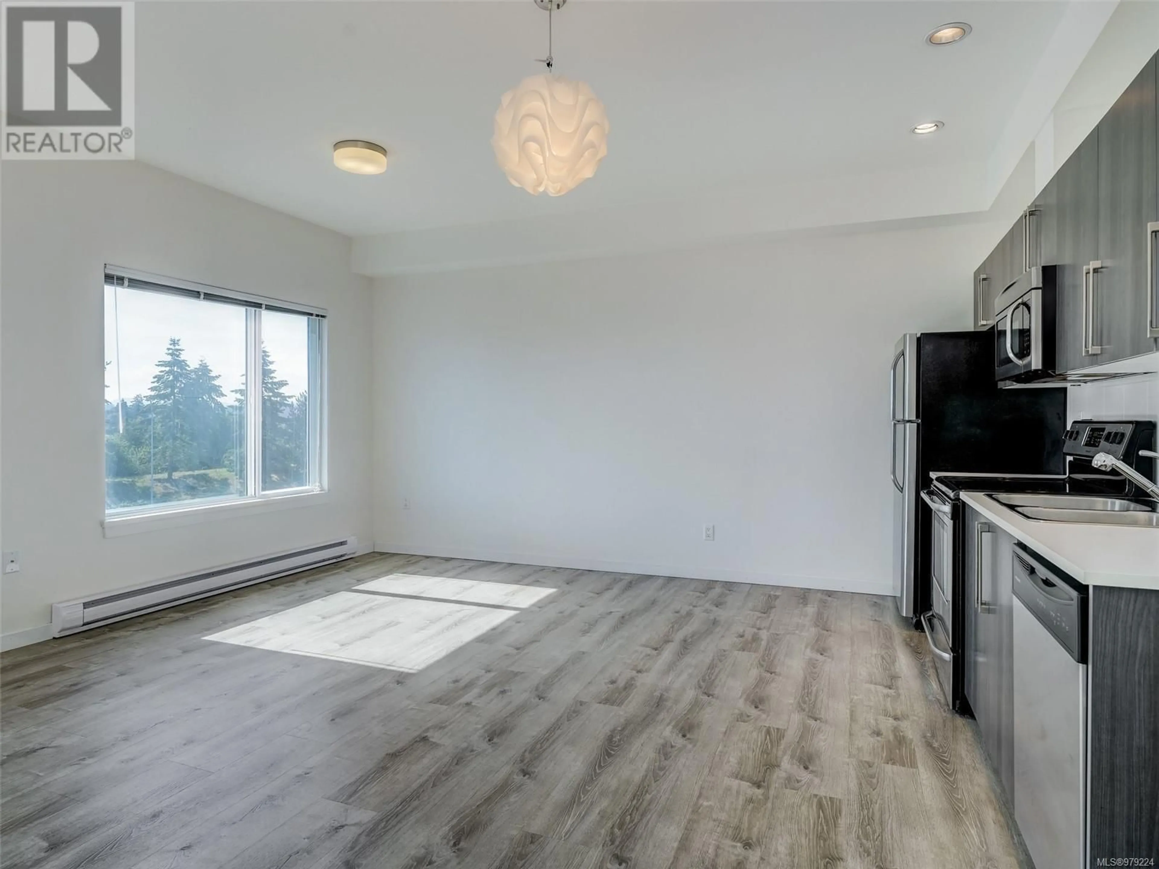 A pic of a room, wood floors for 303 4052 Douglas St, Saanich British Columbia V8X0A5