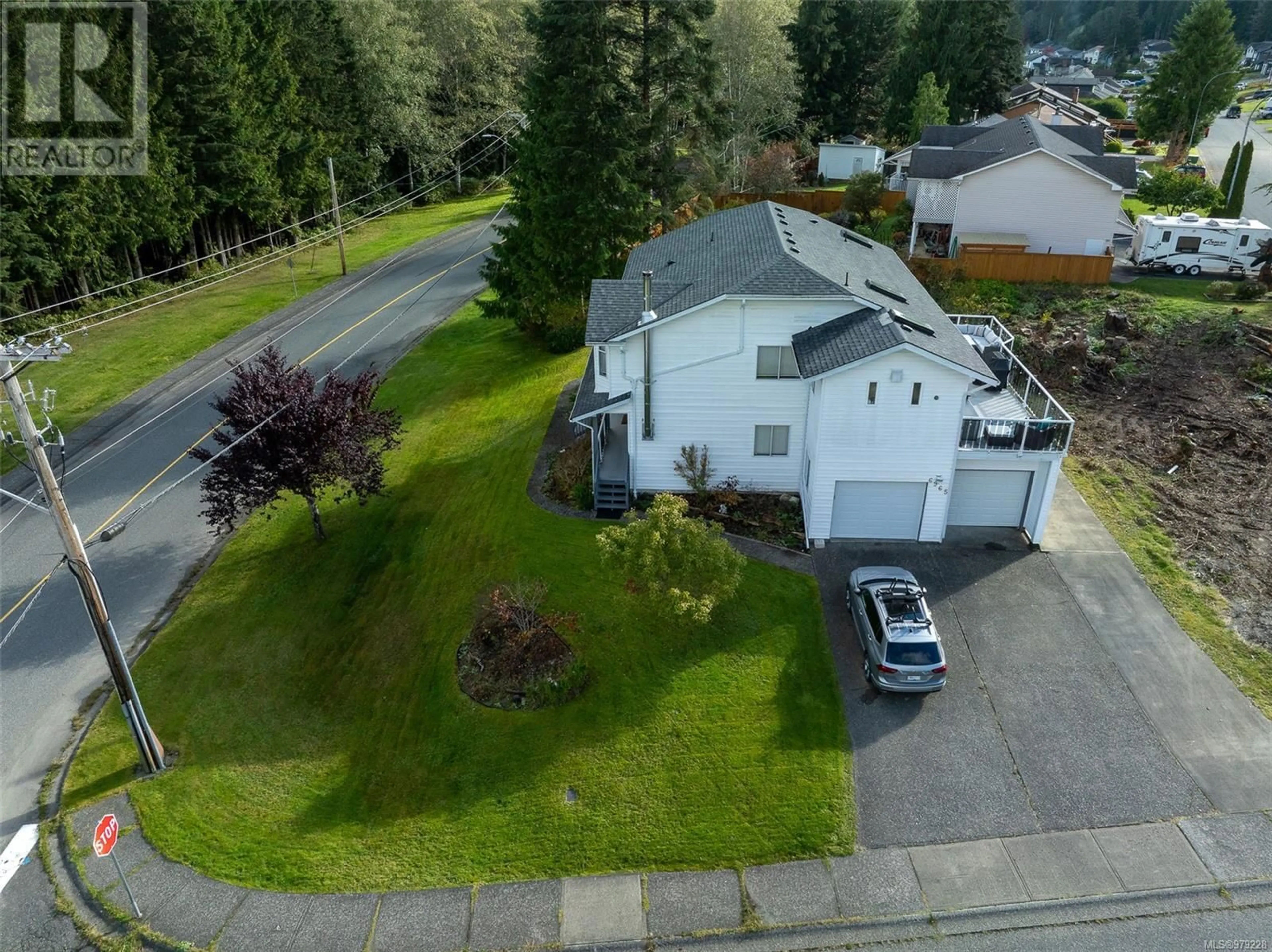 Frontside or backside of a home, the street view for 6965 Highland Dr, Port Hardy British Columbia V0N2P0