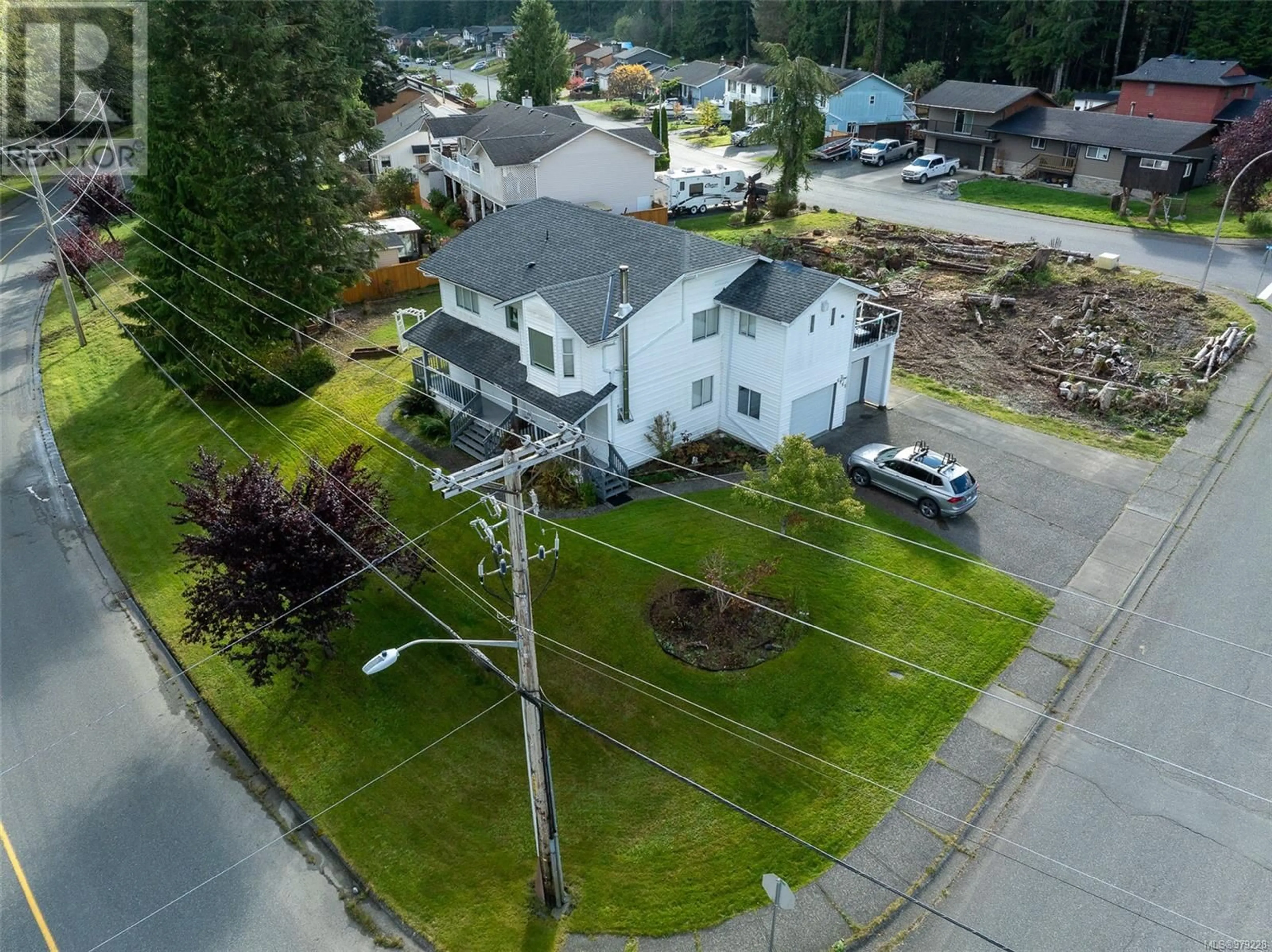 Frontside or backside of a home, the street view for 6965 Highland Dr, Port Hardy British Columbia V0N2P0