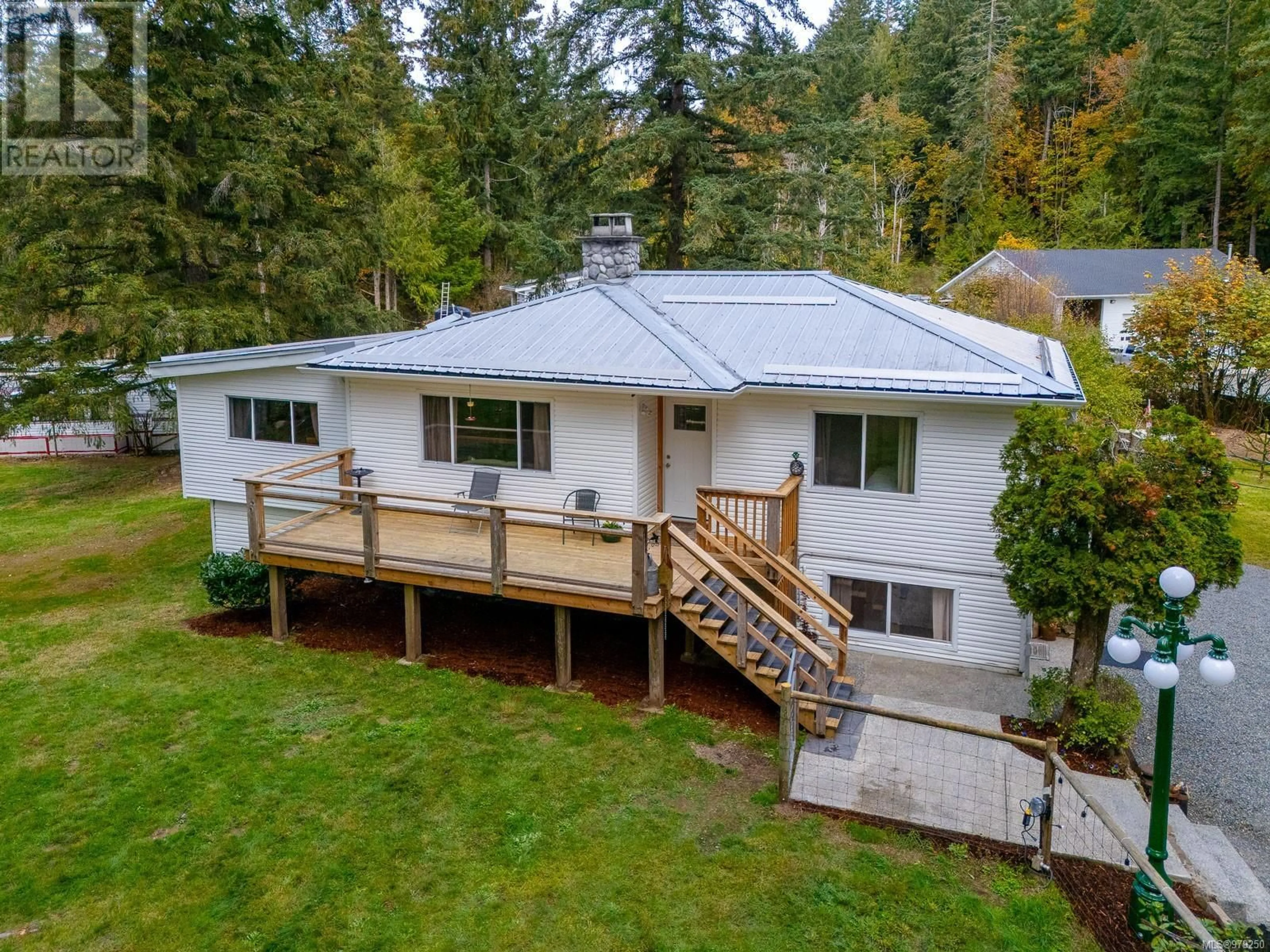 Frontside or backside of a home, the fenced backyard for 4765 Yellow Point Rd, Nanaimo British Columbia V9G1H2