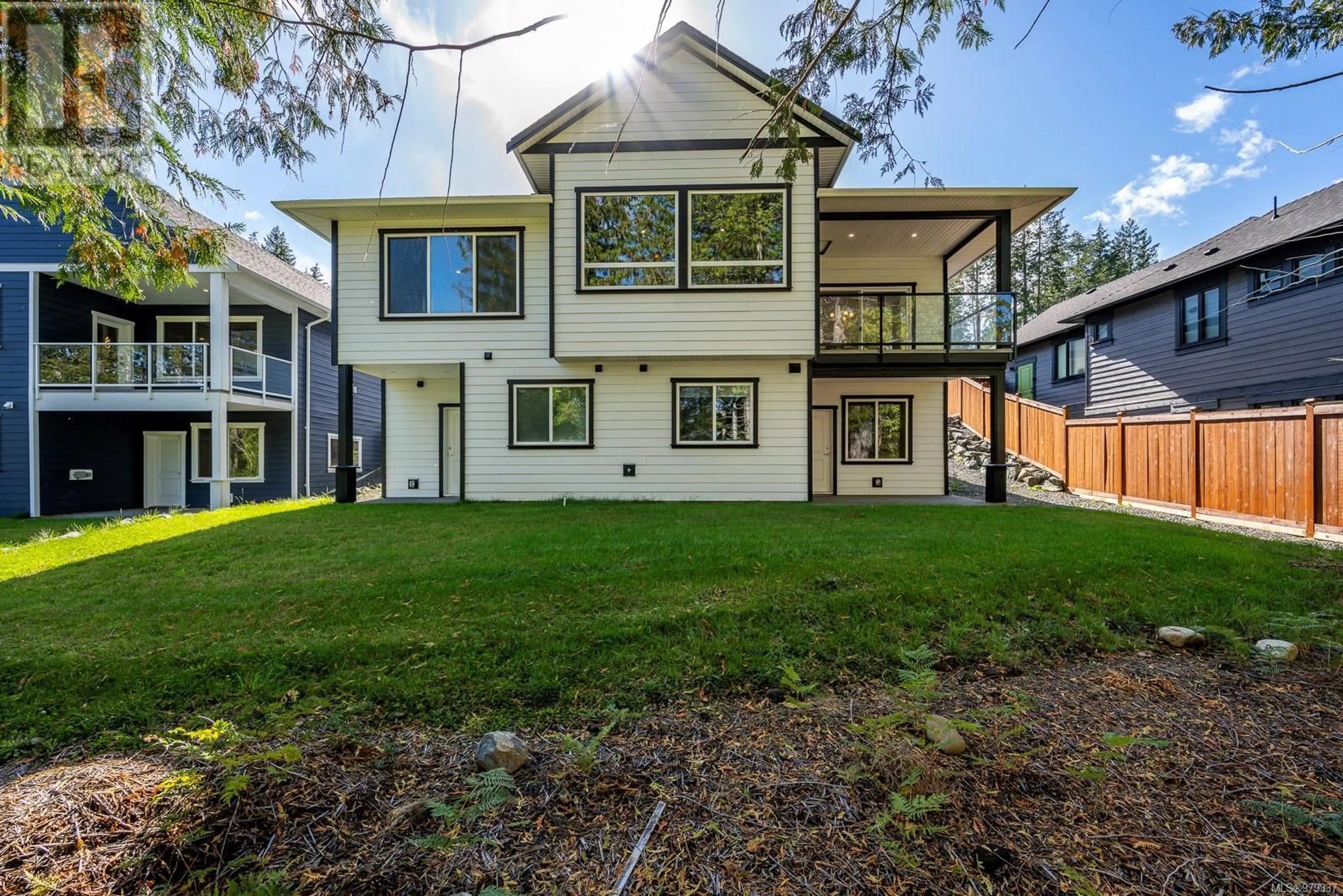 Frontside or backside of a home, the fenced backyard for 3236 Klanawa Cres, Courtenay British Columbia V9N0H4