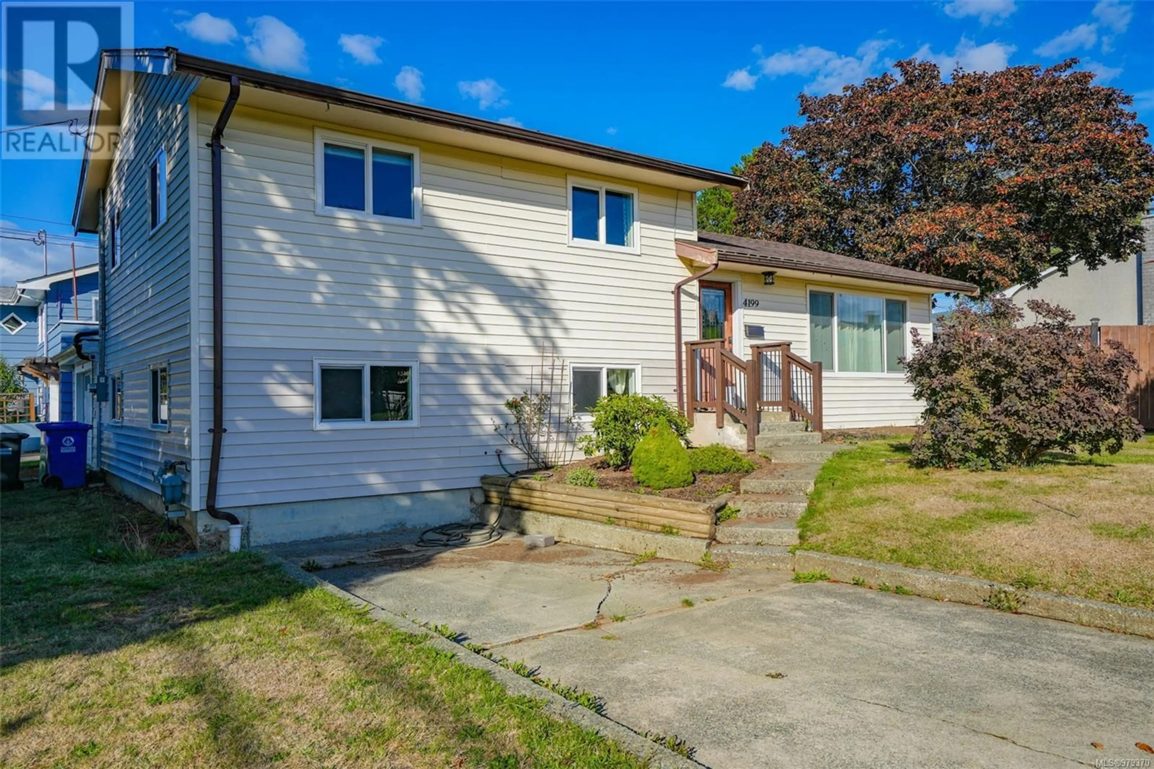 A pic from exterior of the house or condo, the fenced backyard for 4199 Glenside Rd, Port Alberni British Columbia V9Y5X2