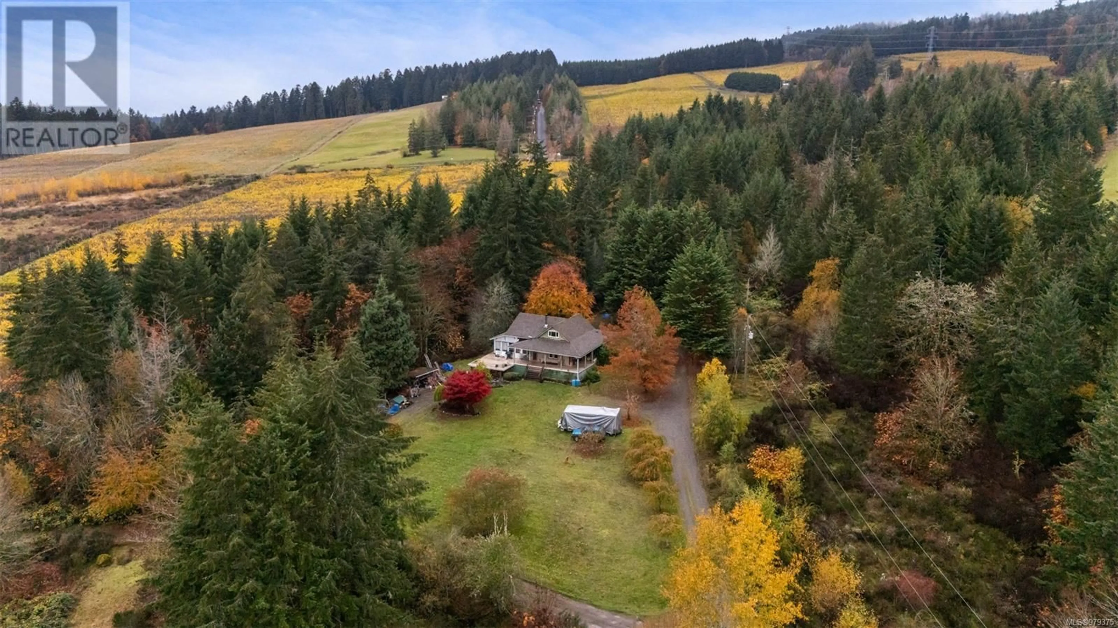 A pic from exterior of the house or condo, the fenced backyard for 6560 North Rd, Duncan British Columbia V9L6K9