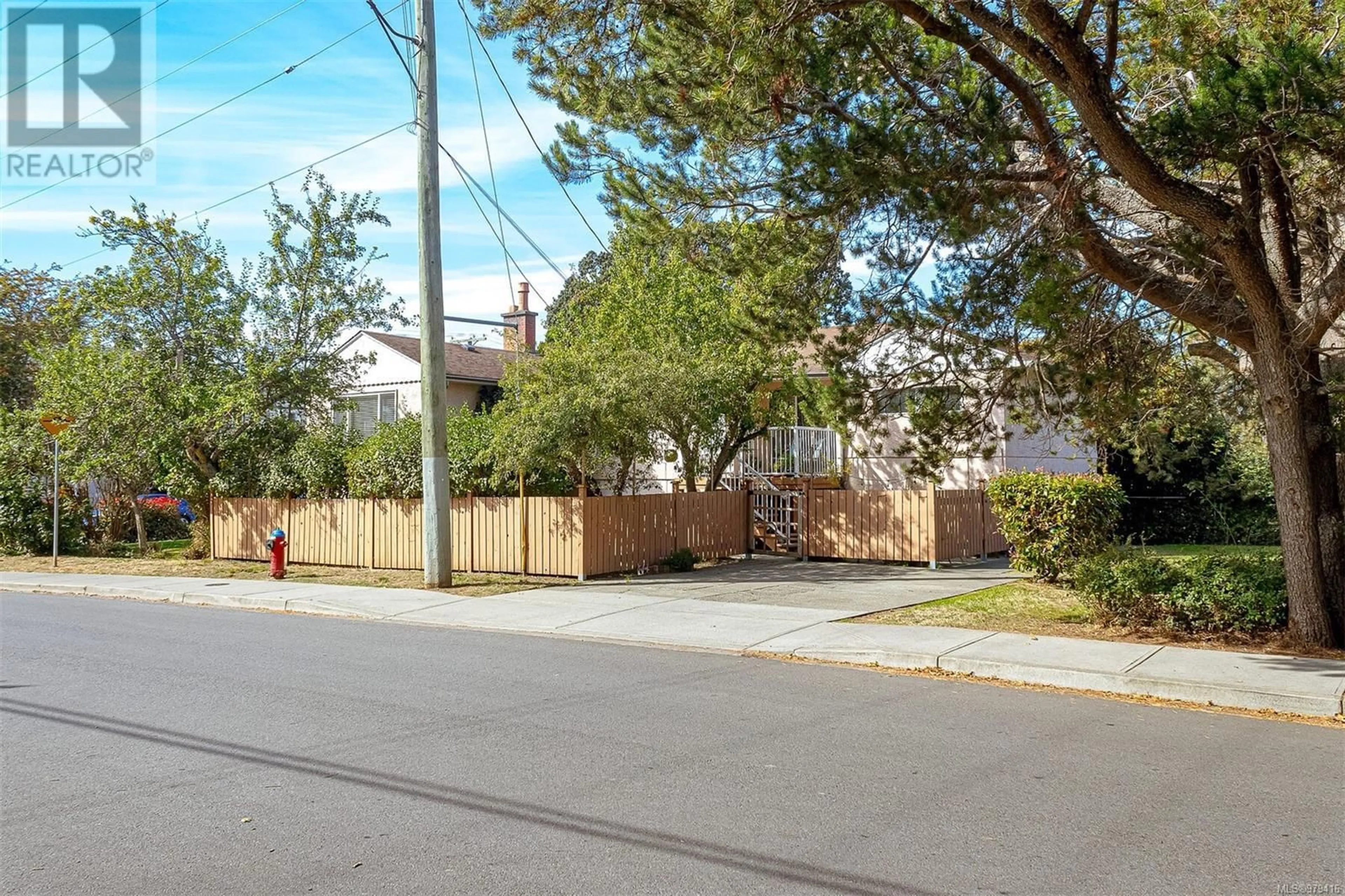 A pic from exterior of the house or condo, the fenced backyard for 1005/1007 Clare St, Victoria British Columbia V8S5B5