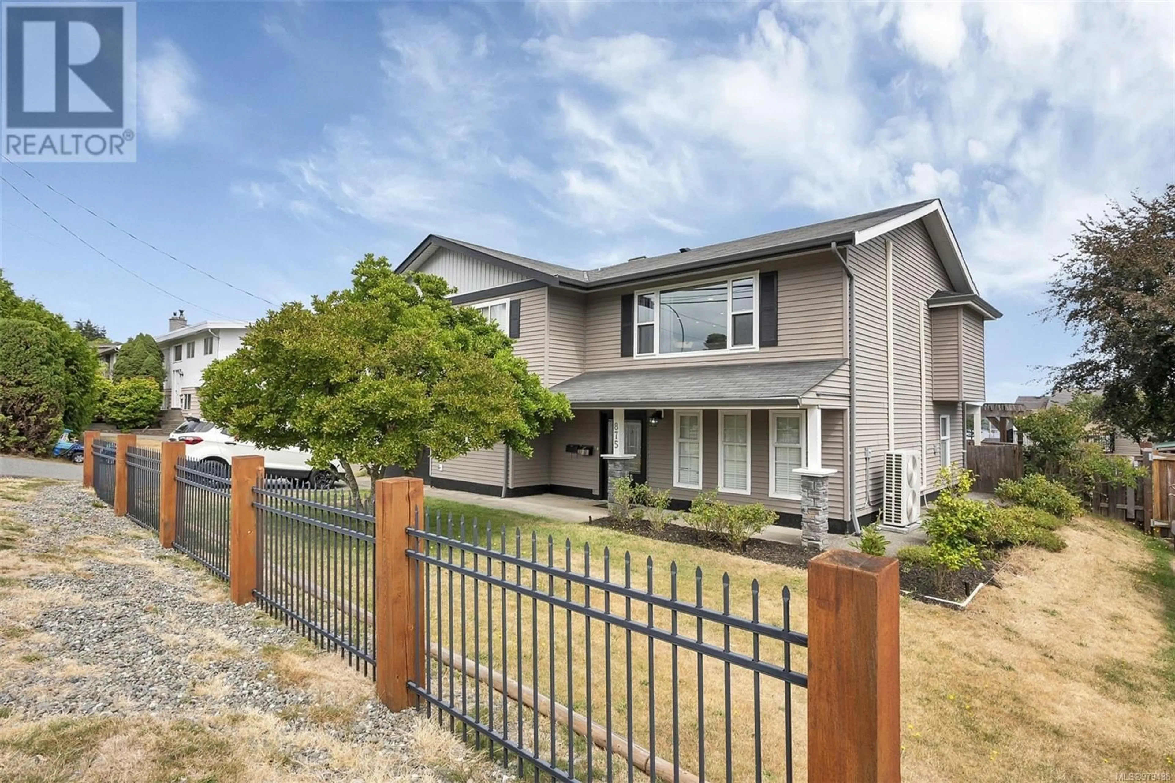 Frontside or backside of a home, the fenced backyard for 875 Alder St S, Campbell River British Columbia V9W1Z4