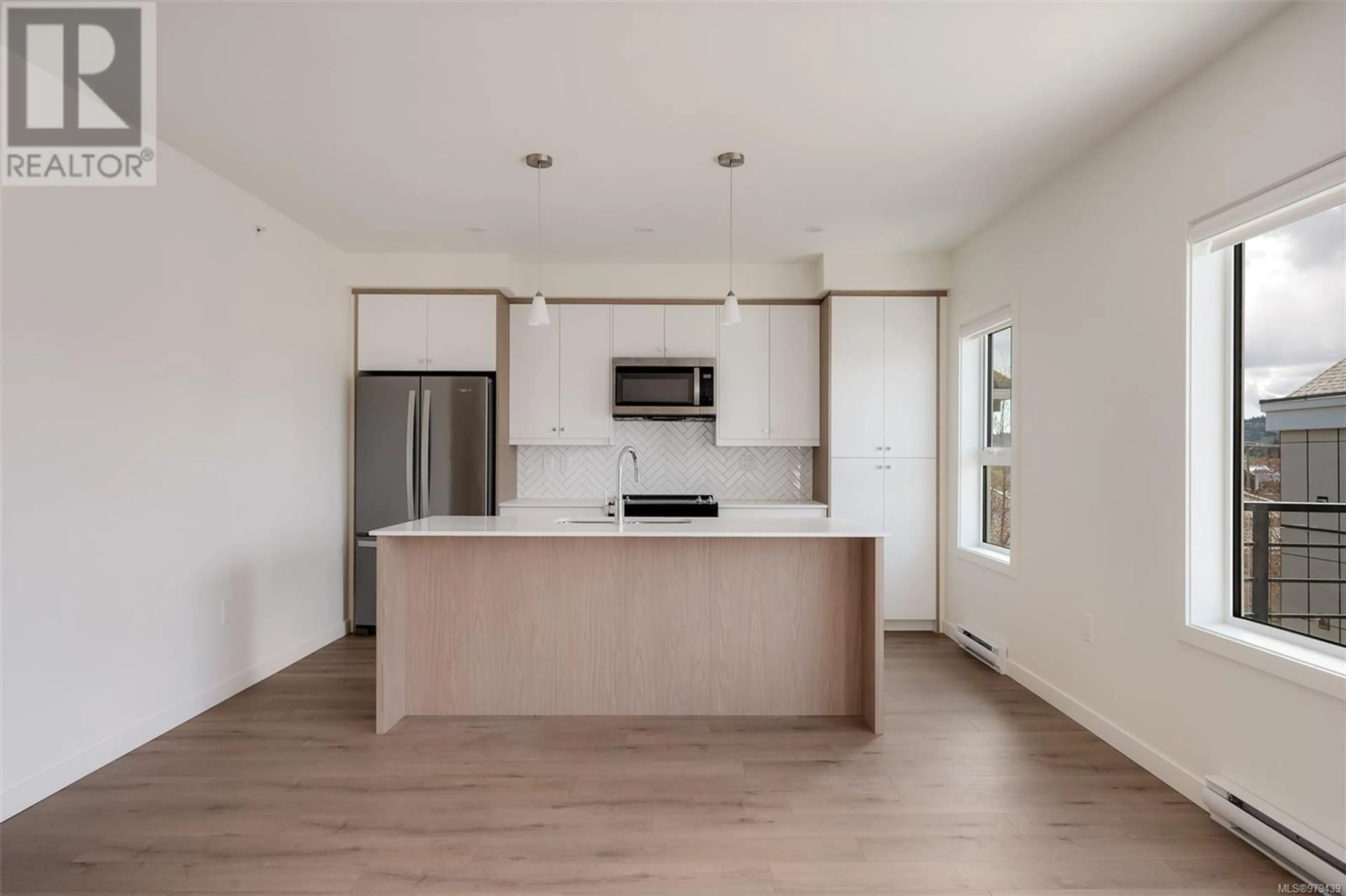 Open concept kitchen for 202 9716 Third St, Sidney British Columbia V8L3A2