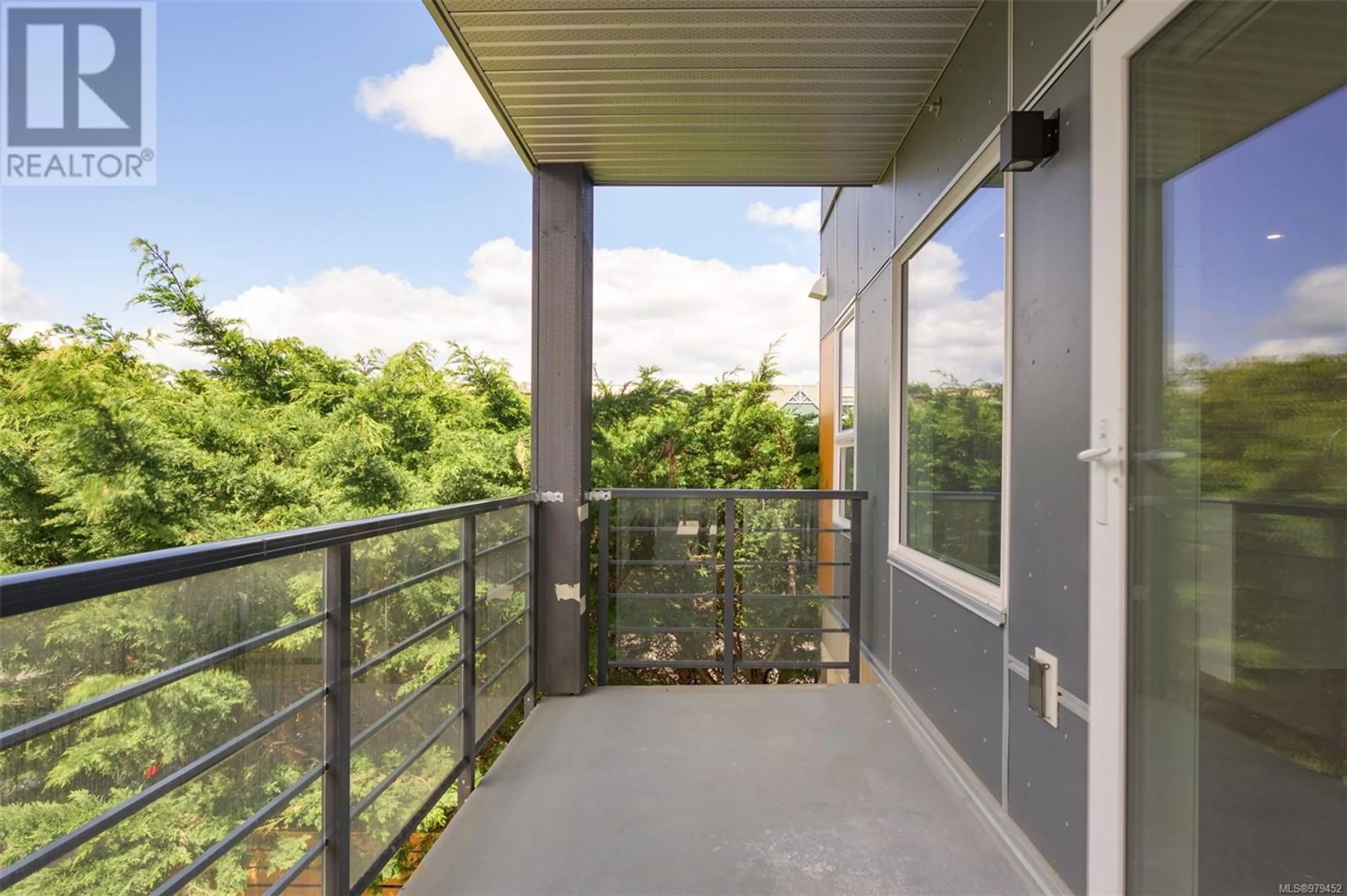 Balcony in the apartment, the fenced backyard for 203 9716 Third St, Sidney British Columbia V8L3A2