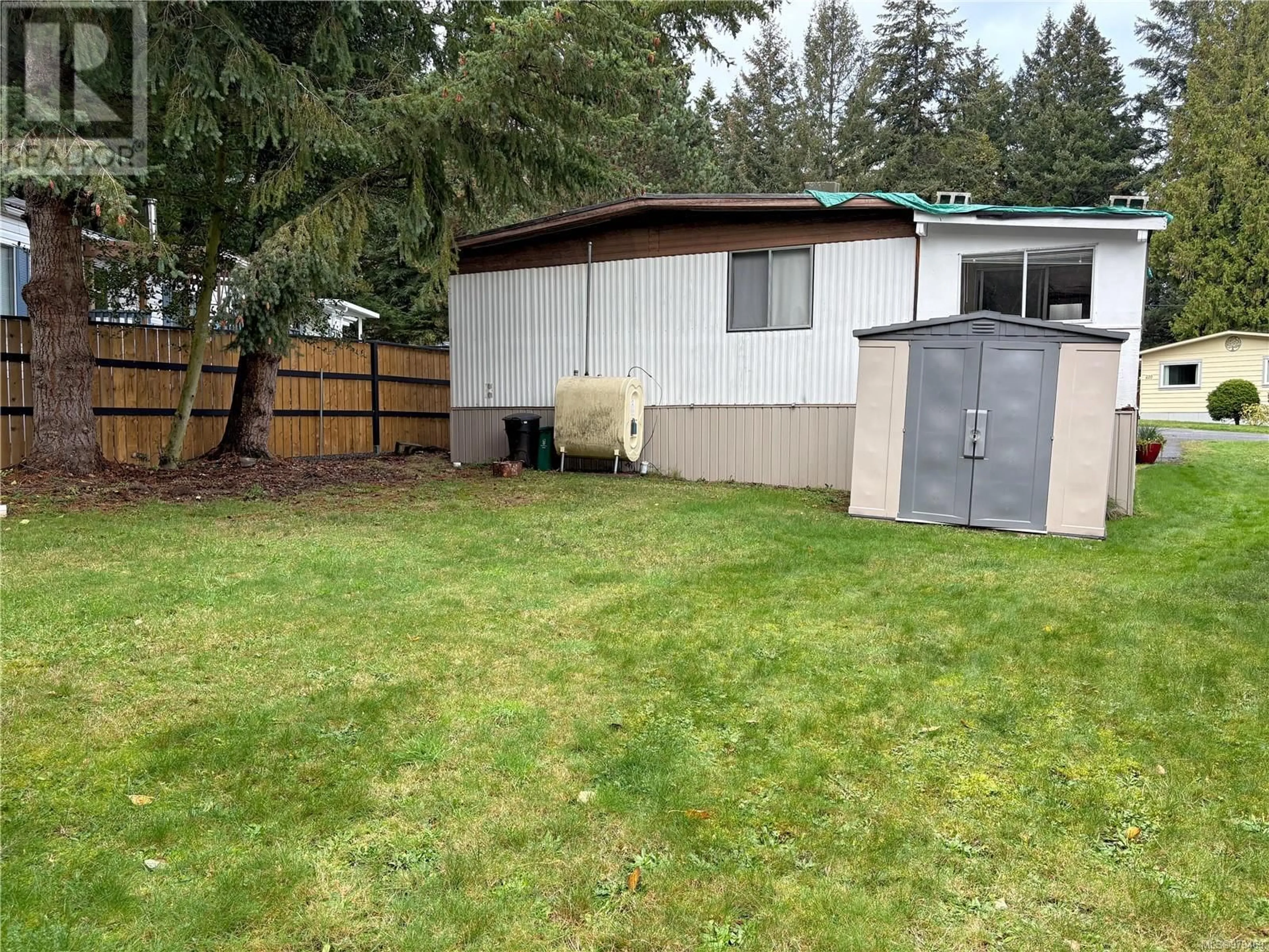 Frontside or backside of a home, the fenced backyard for 244 2465 Apollo Dr, Nanoose Bay British Columbia V9P9K2