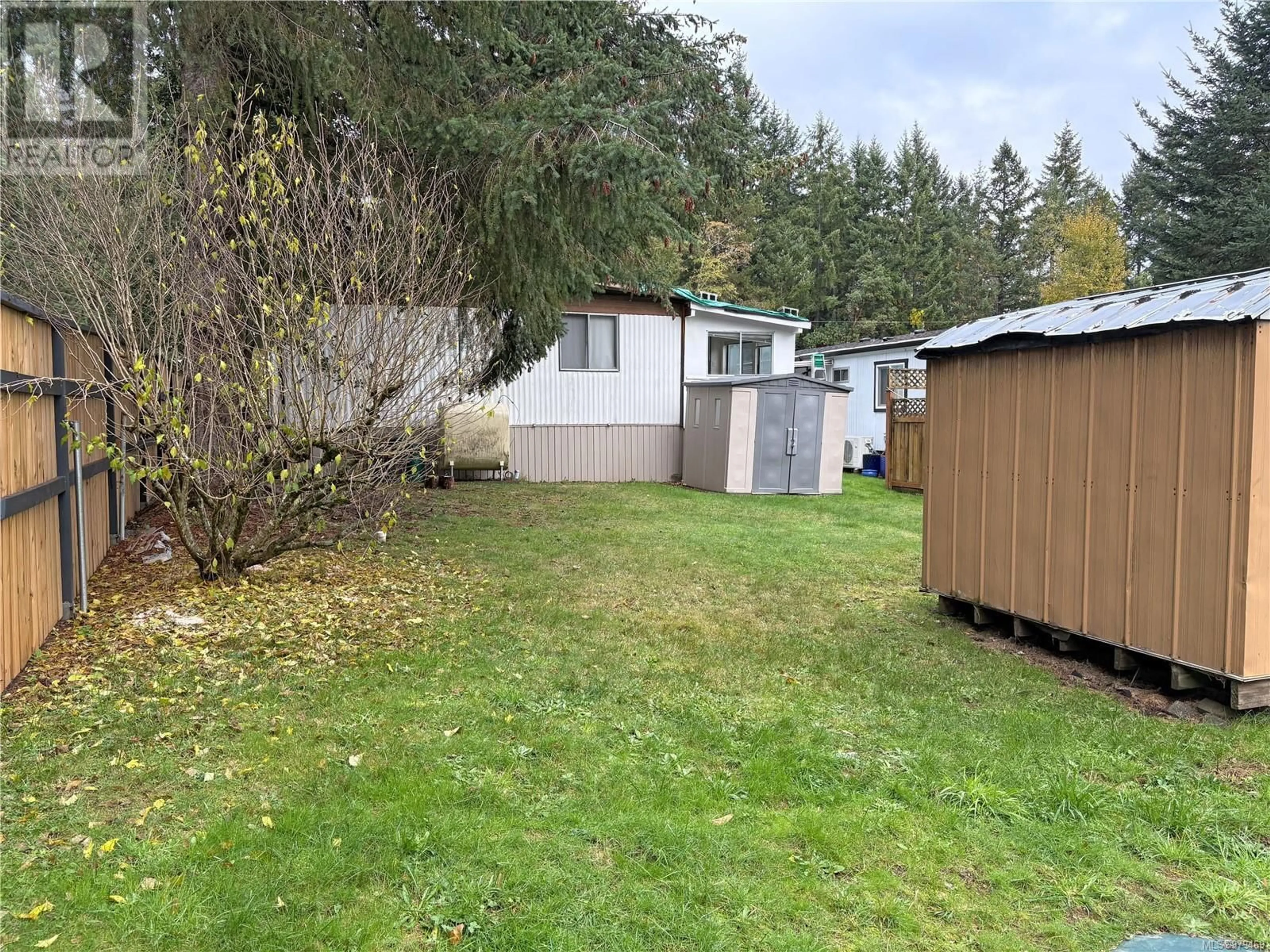 Frontside or backside of a home, the fenced backyard for 244 2465 Apollo Dr, Nanoose Bay British Columbia V9P9K2